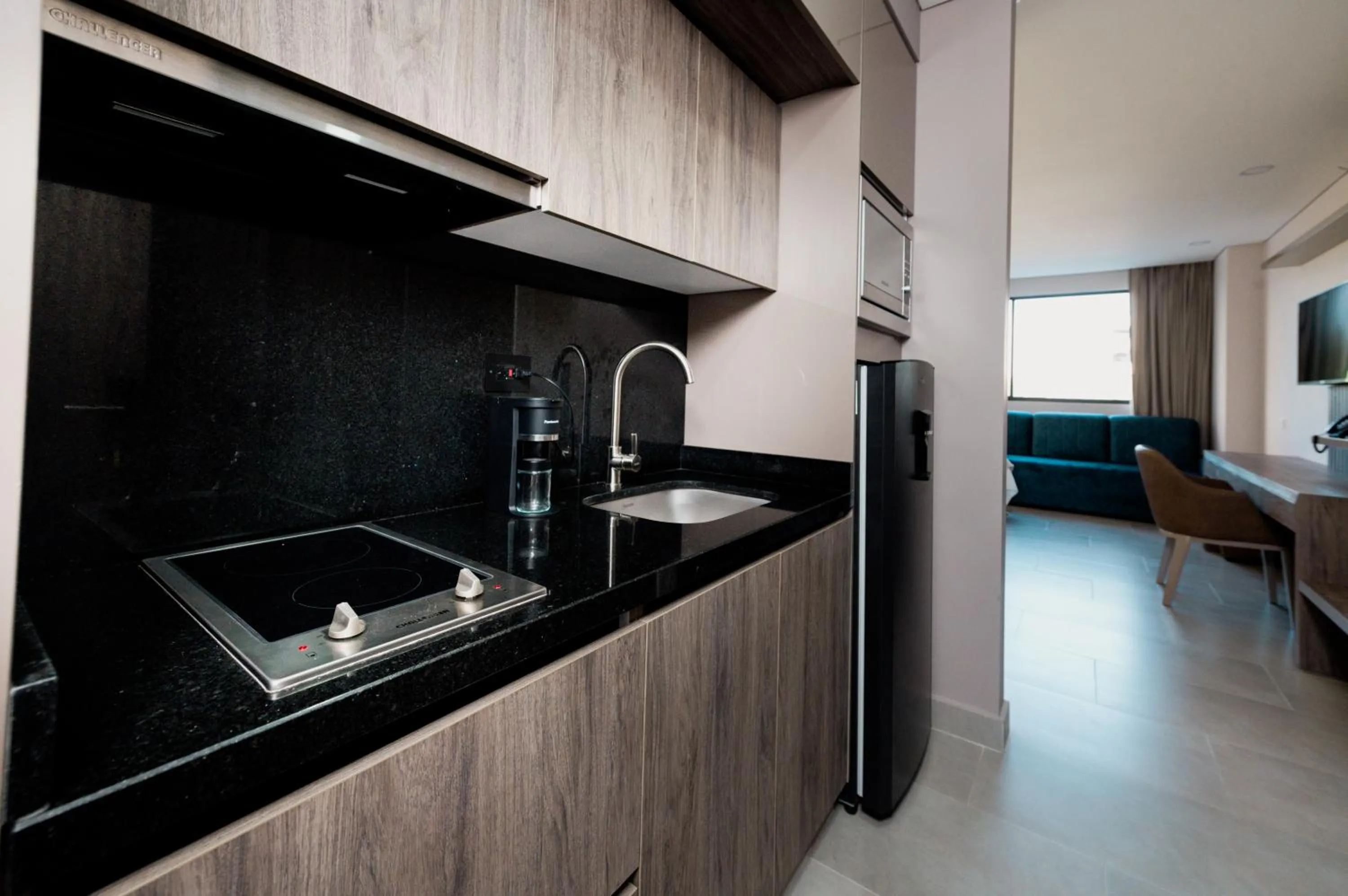 Kitchen or kitchenette in Amari Living Suites