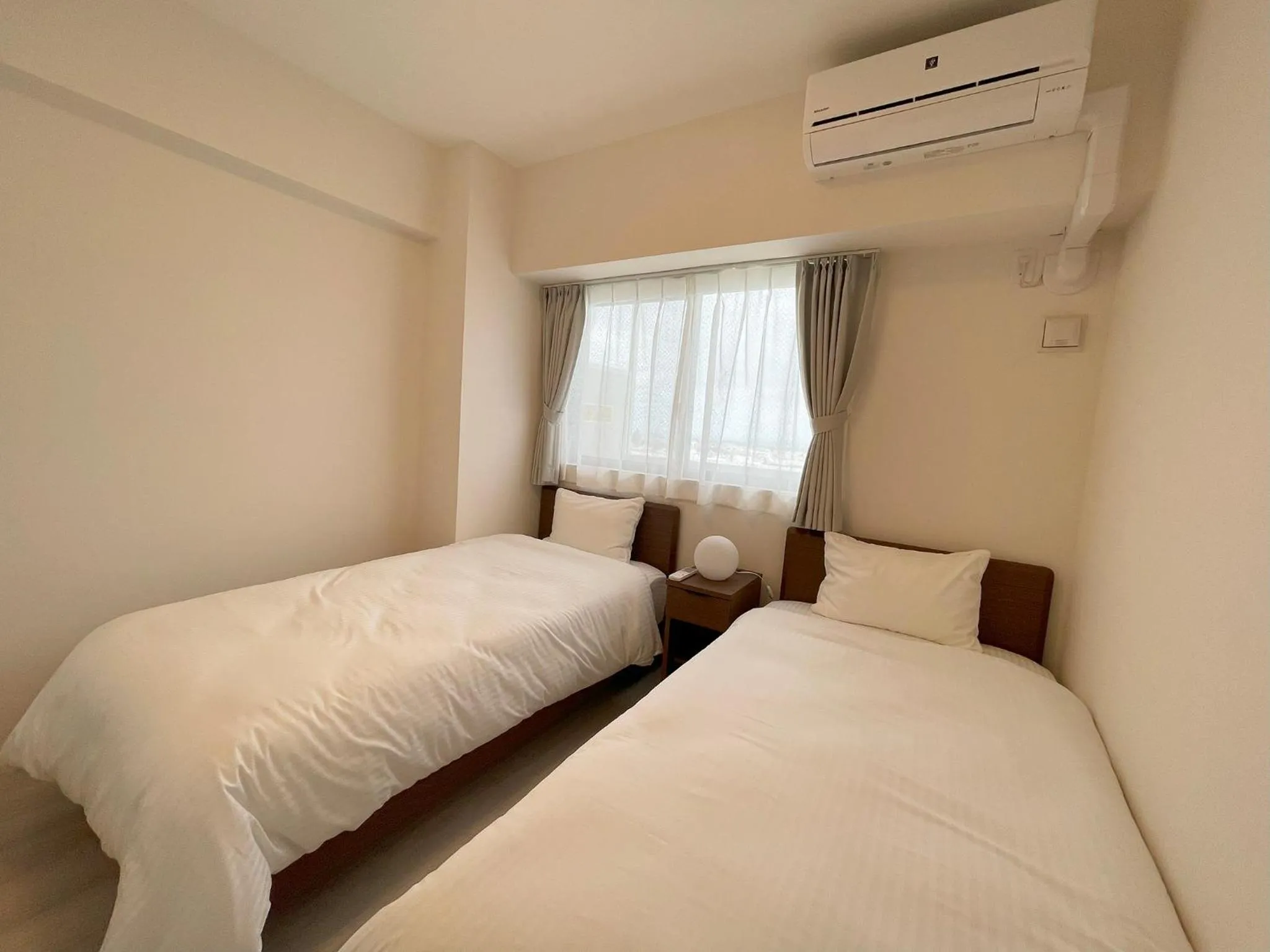 Bed in ＆Monde. Okinawa Arena Condominium