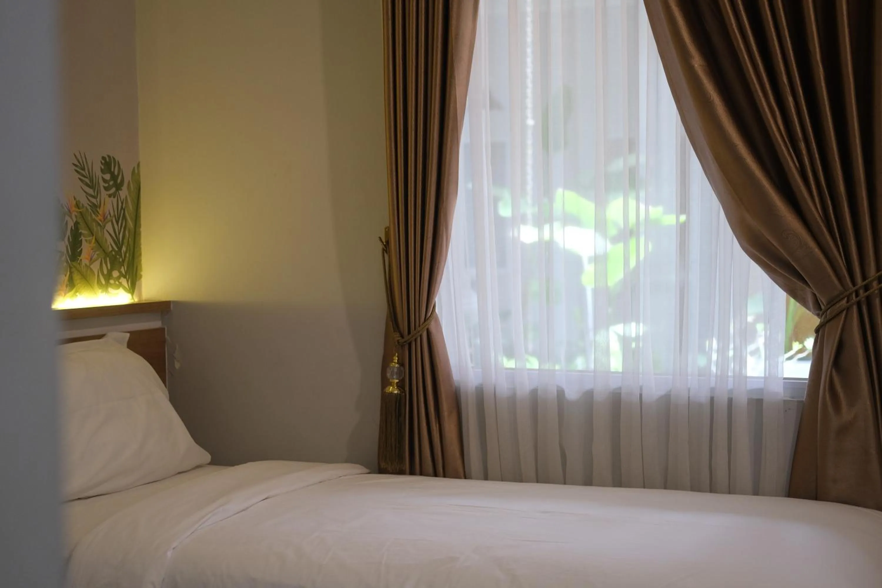 Bedroom, Bed in Caniga Hotel Yogyakarta