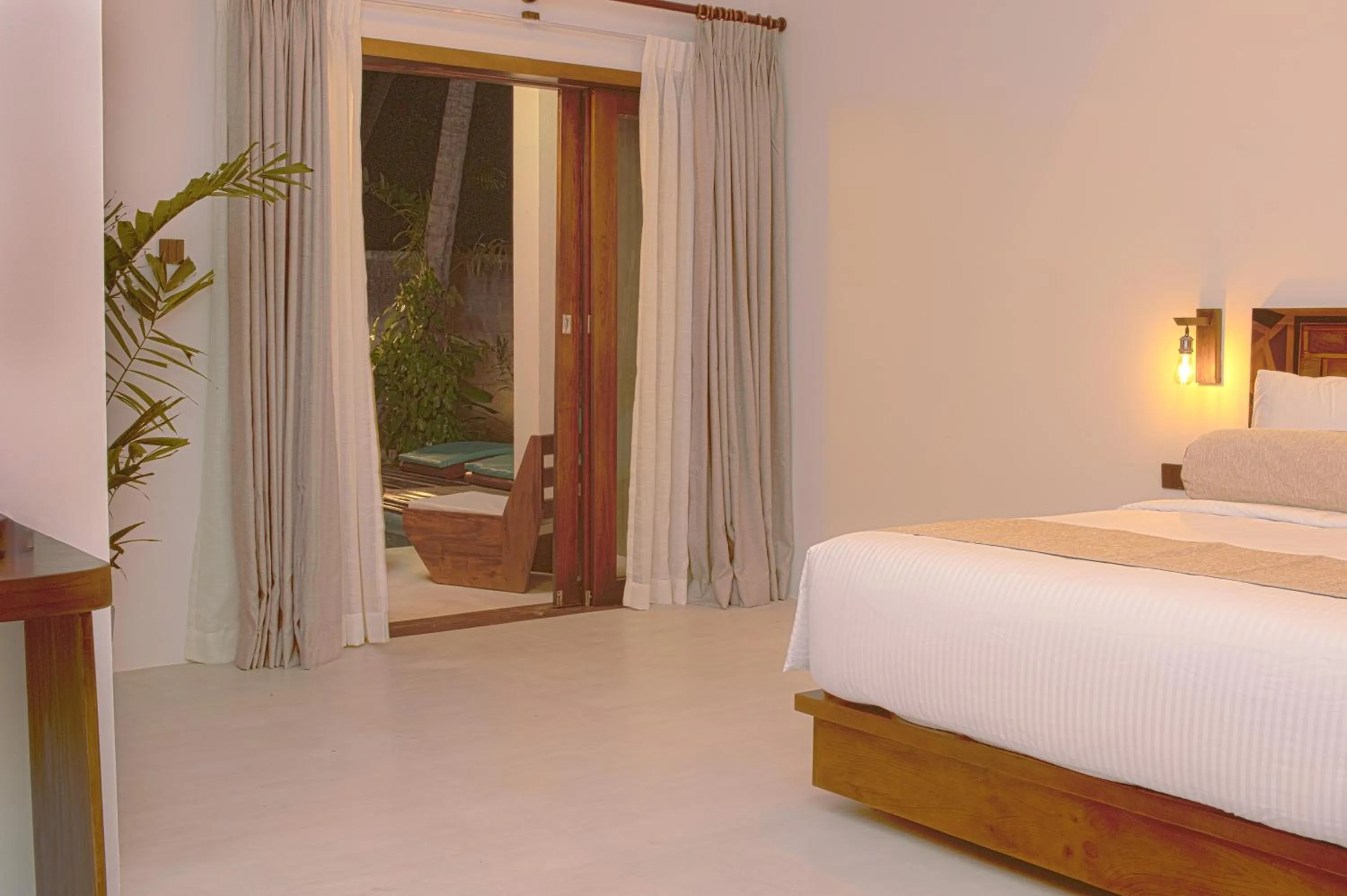 Seating area, Bed in Spicepeek Boutique Hotel CMB Airport