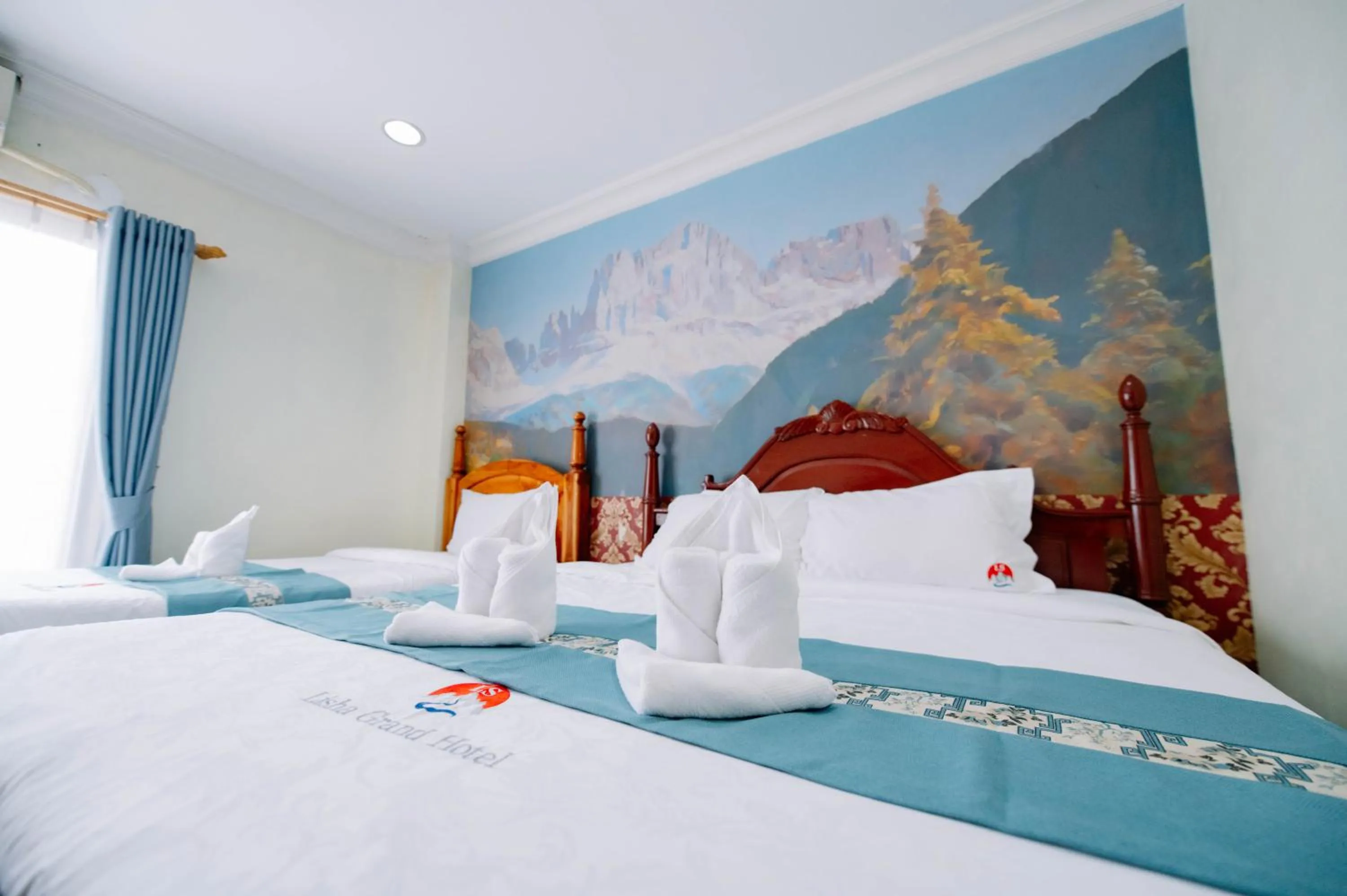 Bed in Lisha Roungnakhone Hotel