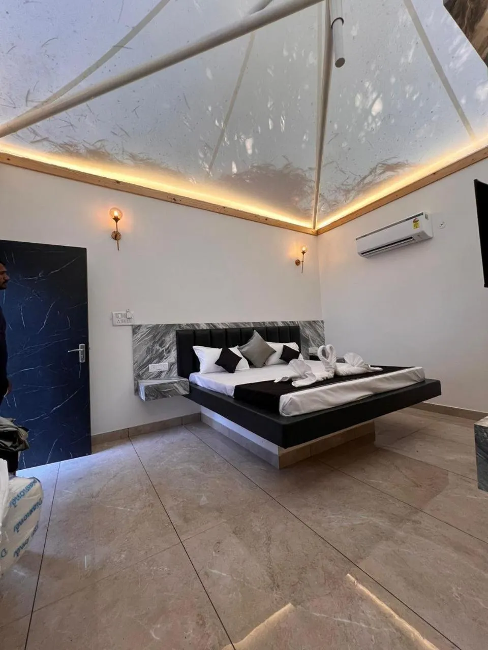 Bed in The Whispering Palms Resort