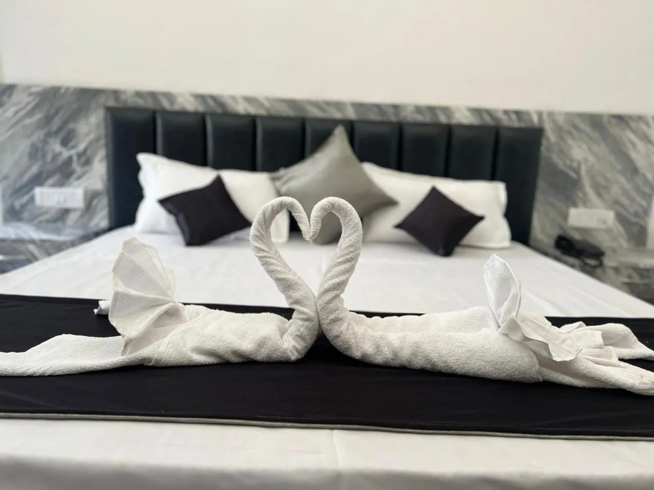 Bed in The Whispering Palms Resort