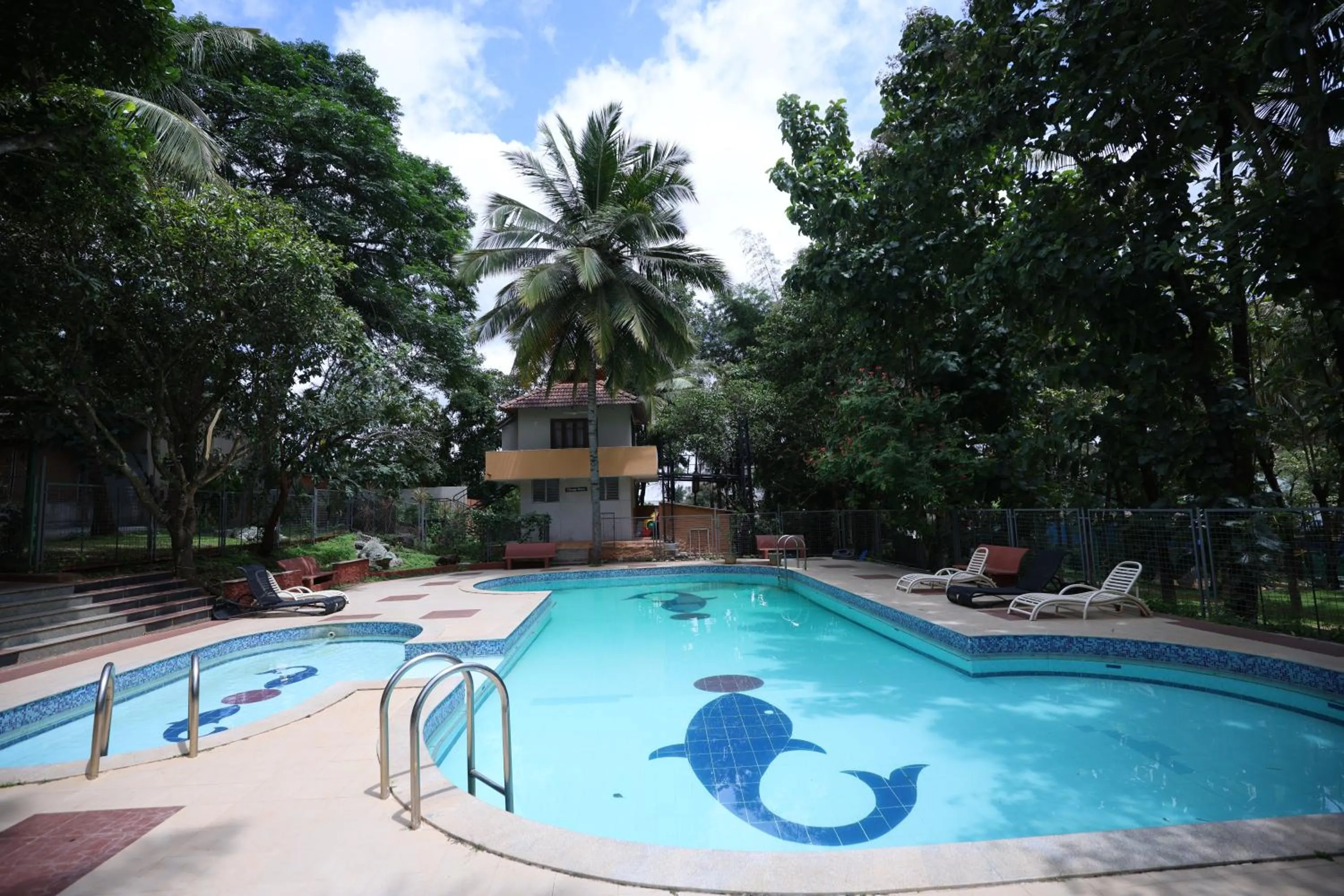 Swimming pool in Nisarga Resort