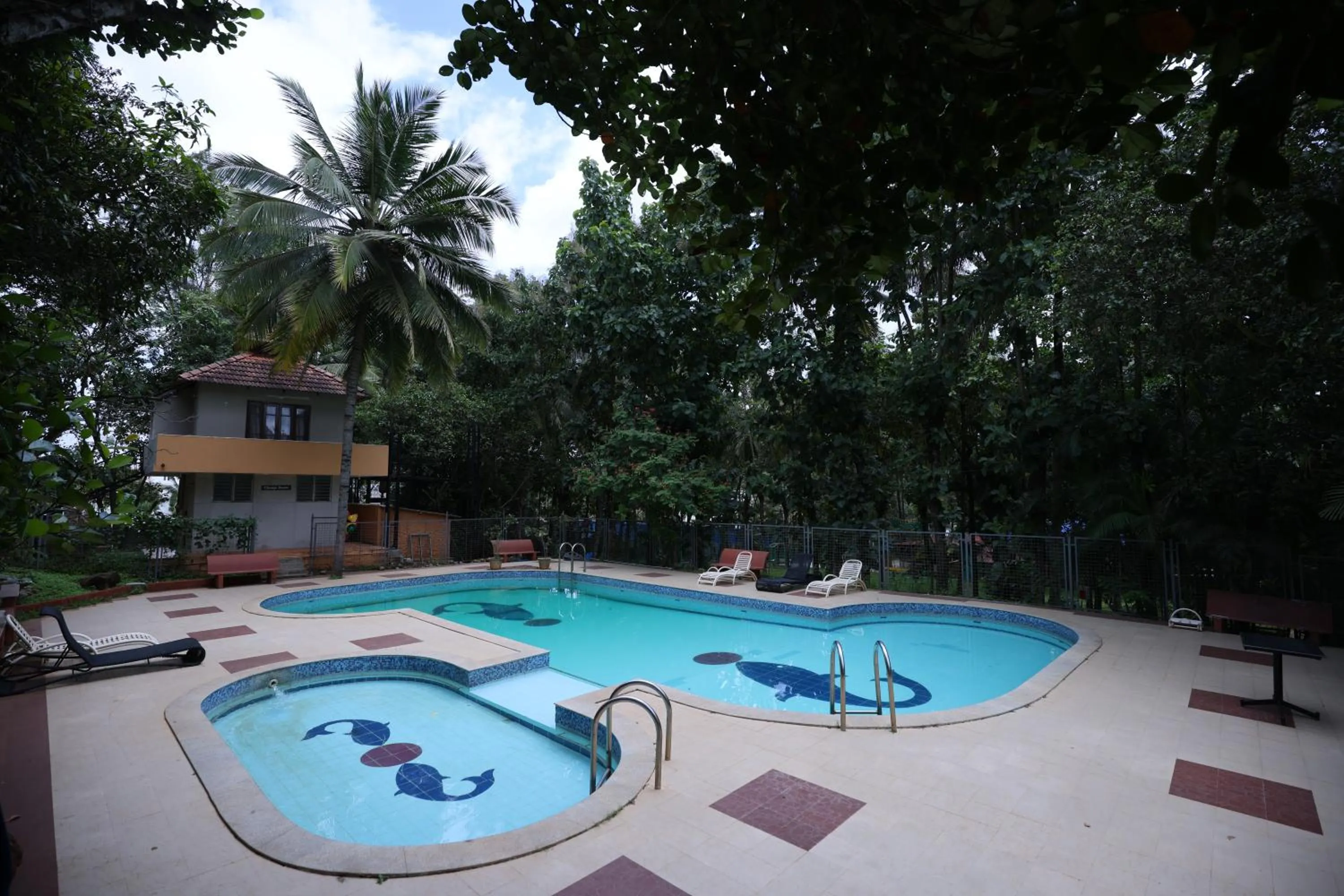Swimming pool in Nisarga Resort