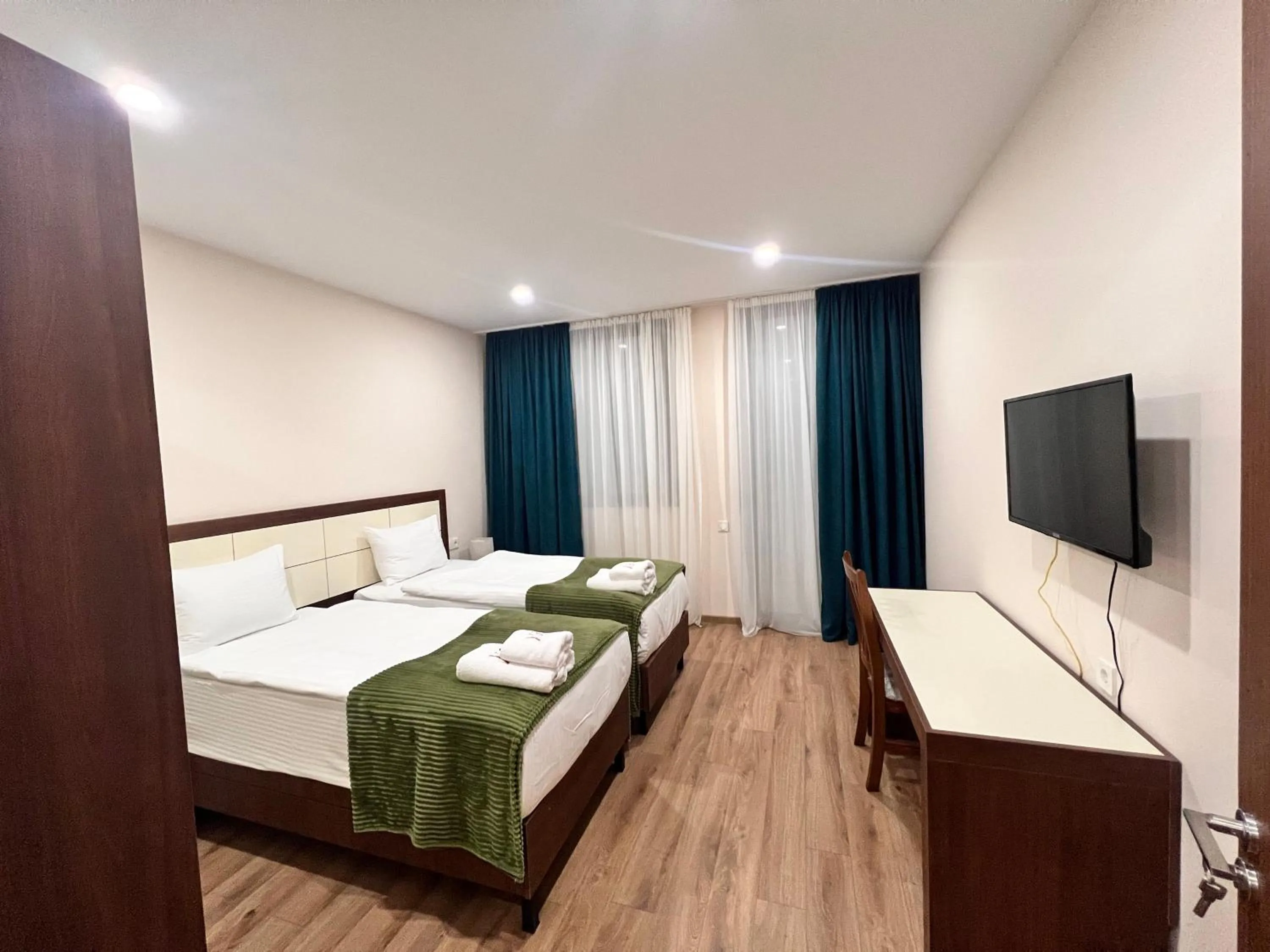 Communal lounge/ TV room, Bed in HOTEL WEST TBILISI