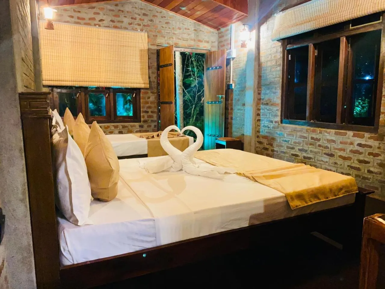 Bed in TEARAMB HOLIDAY BUNGALOW