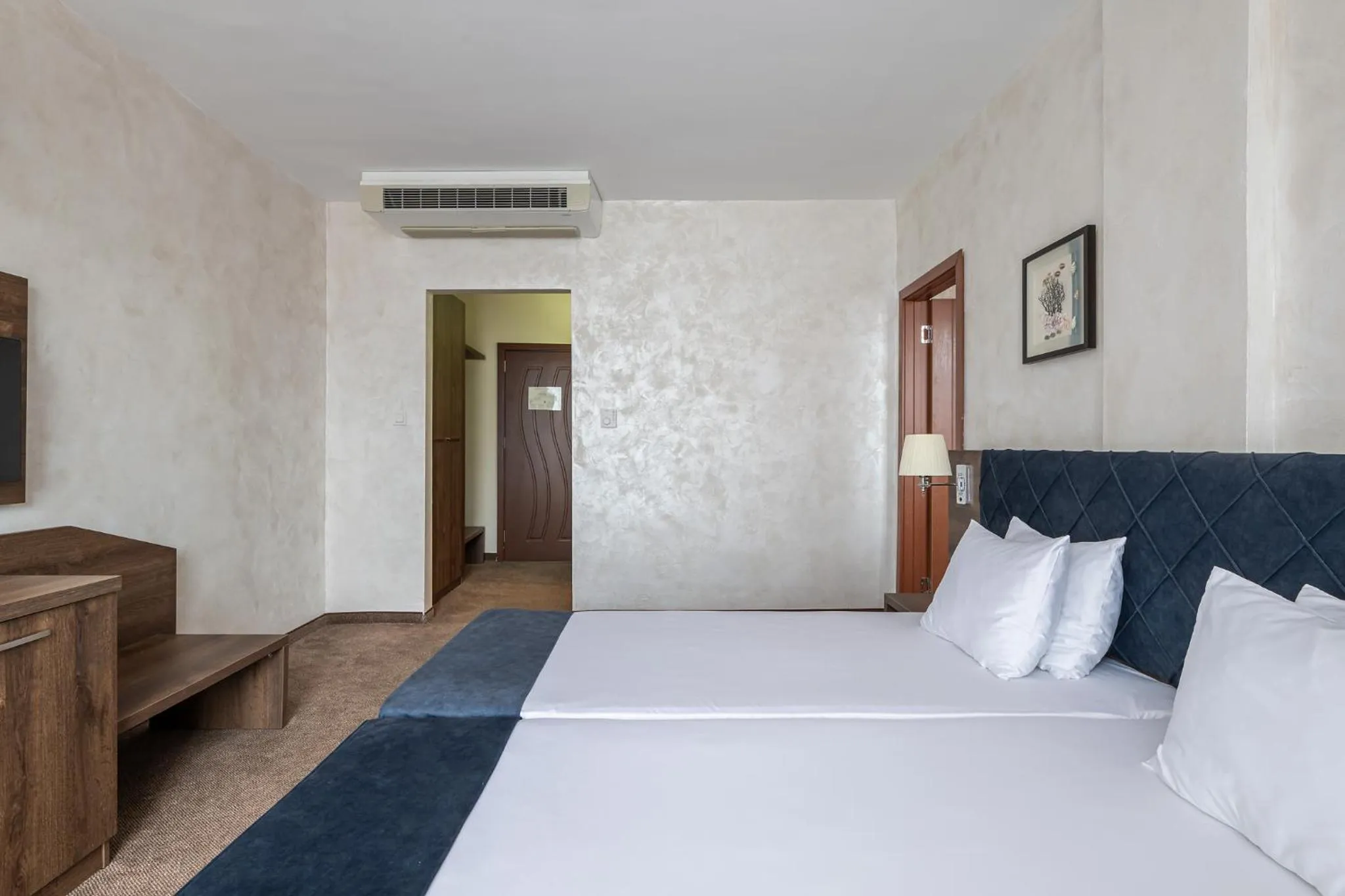 Bed in Flamingo Beach Hotel