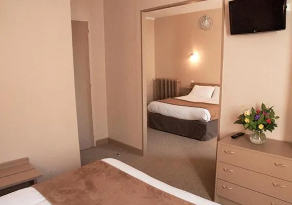 Bed in Hôtel des Pyrénées