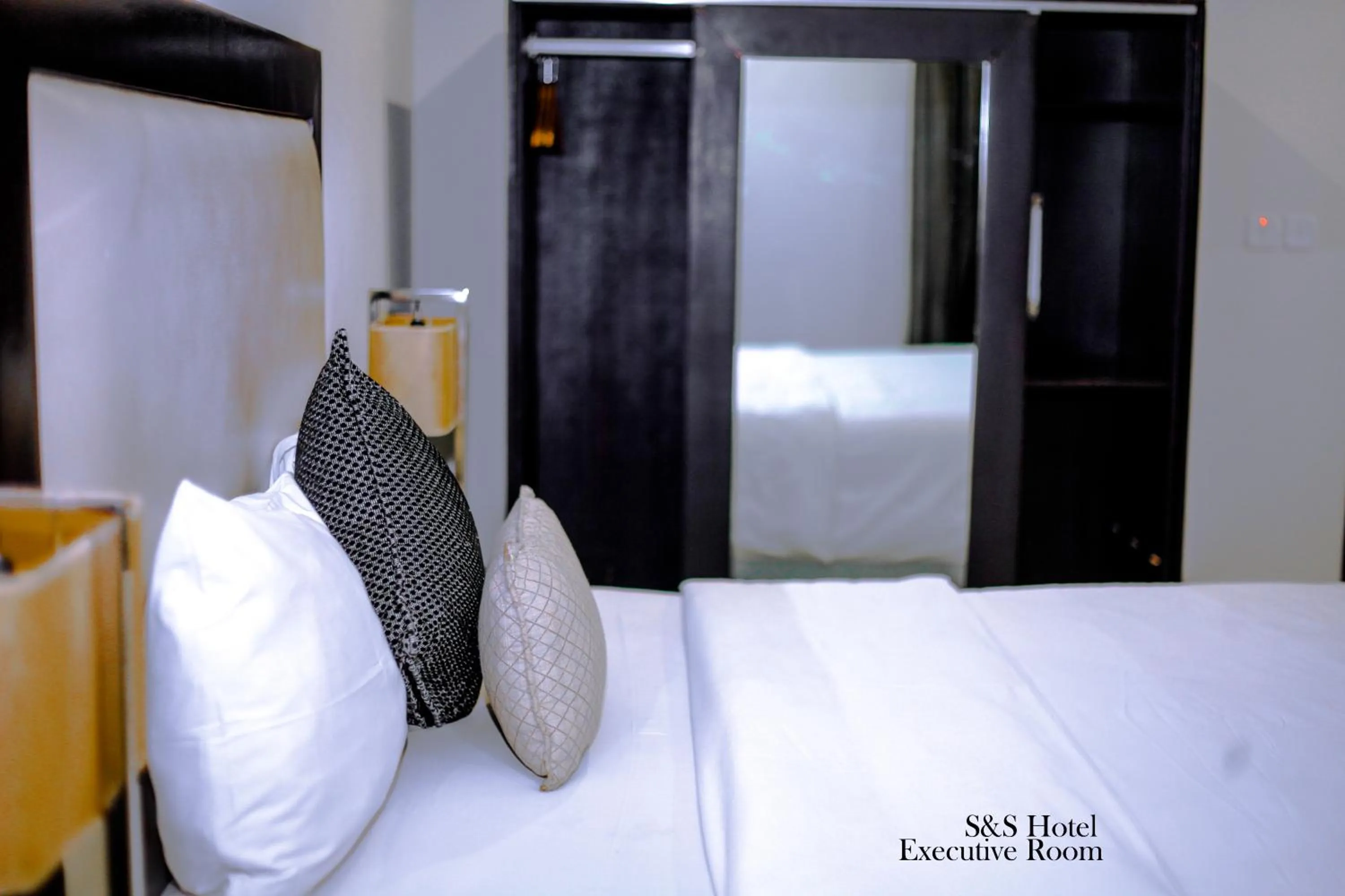 Bed in S & S Hotel & Suites