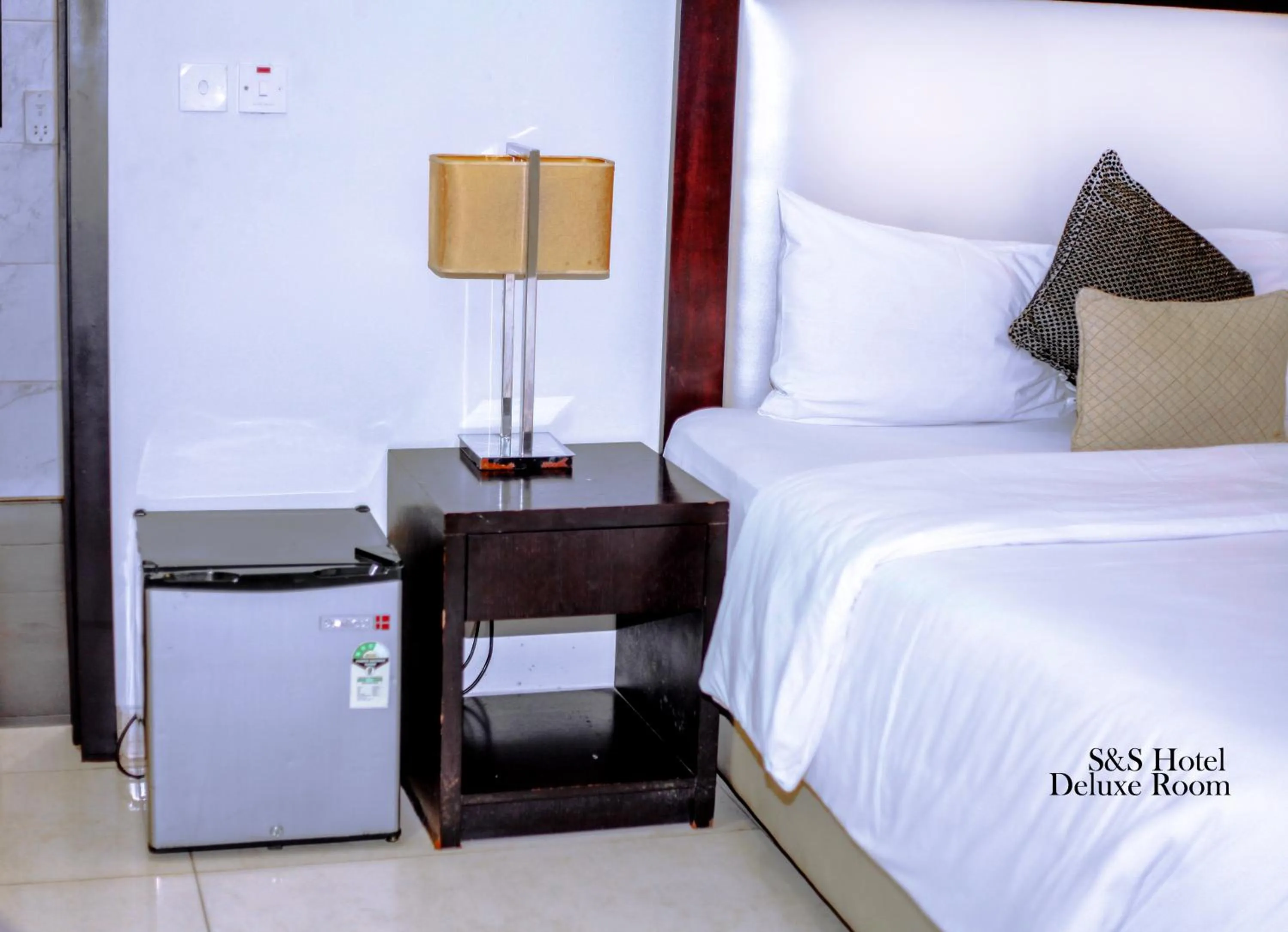Bed in S & S Hotel & Suites