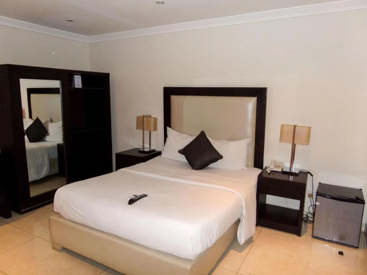 Bed in S & S Hotel & Suites