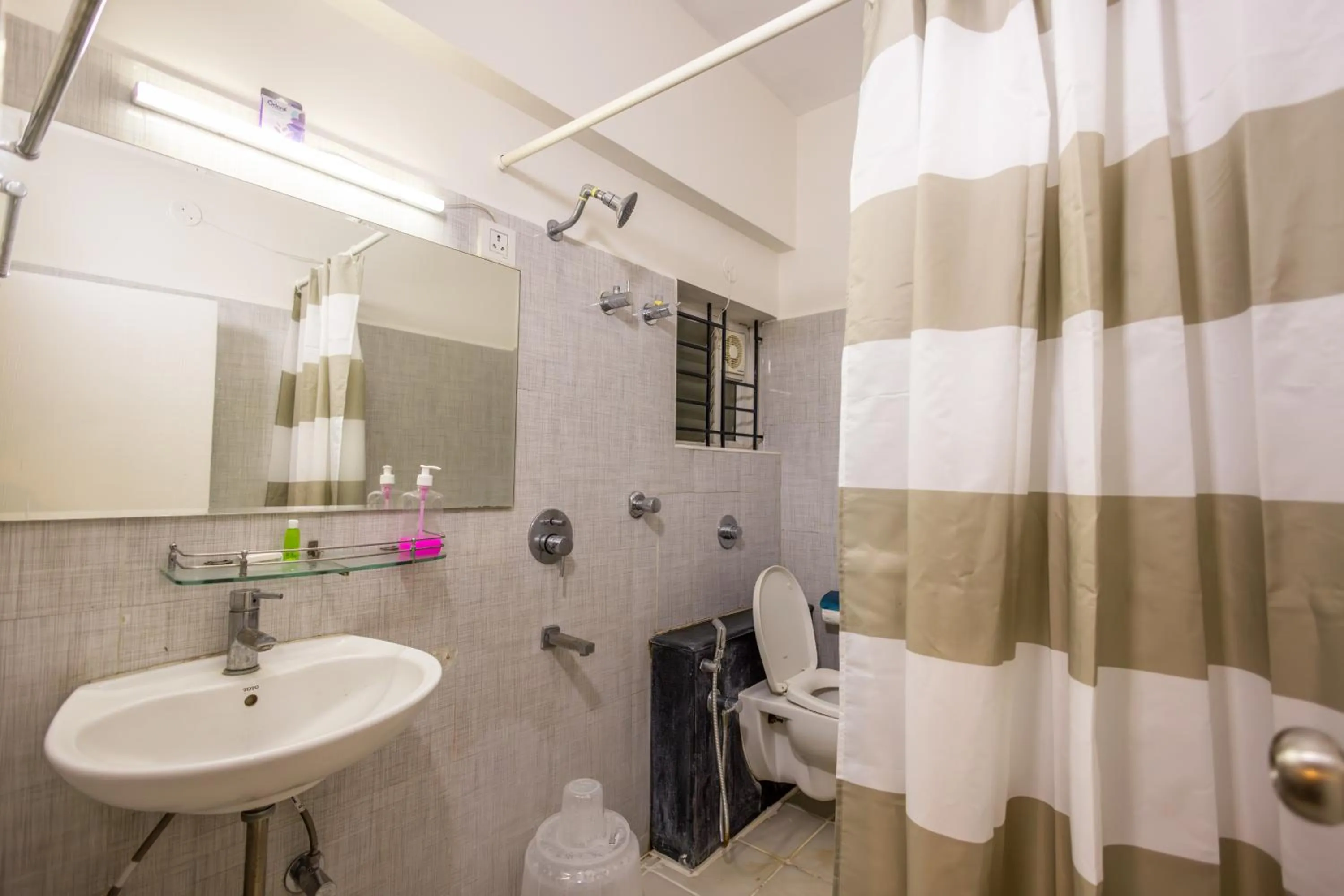 Bathroom in Suraksha Stay Brookfield Hotel