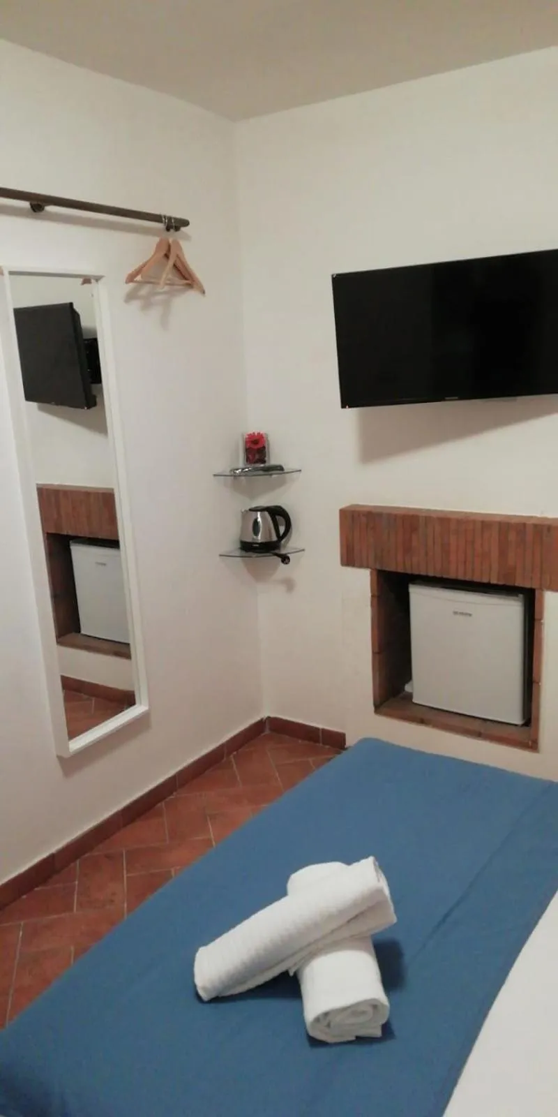 Communal lounge/ TV room, Bed in Relais Arco Della Pace