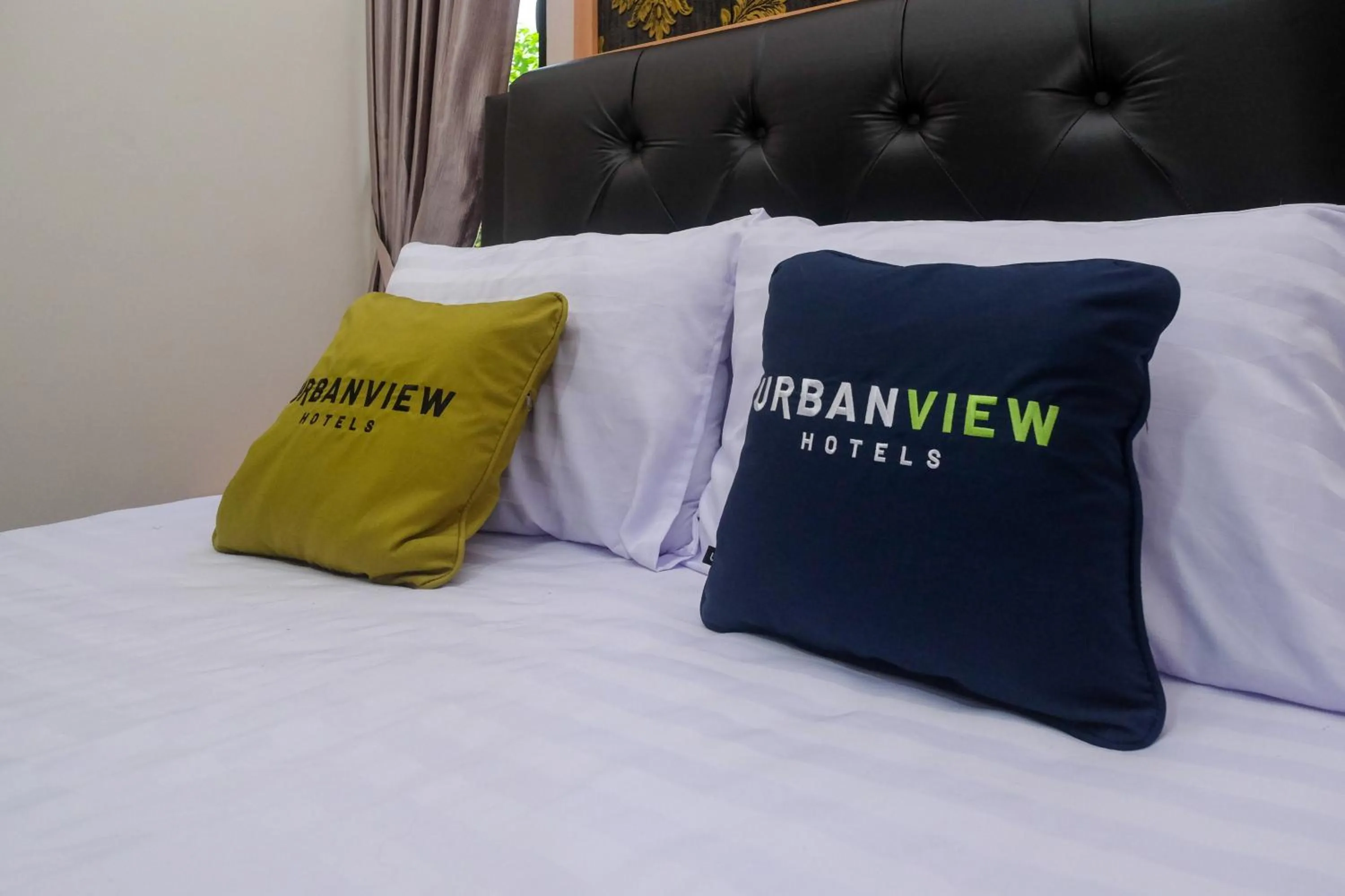 Bed in Urbanview Grand Lotus Hotel by RedDoorz