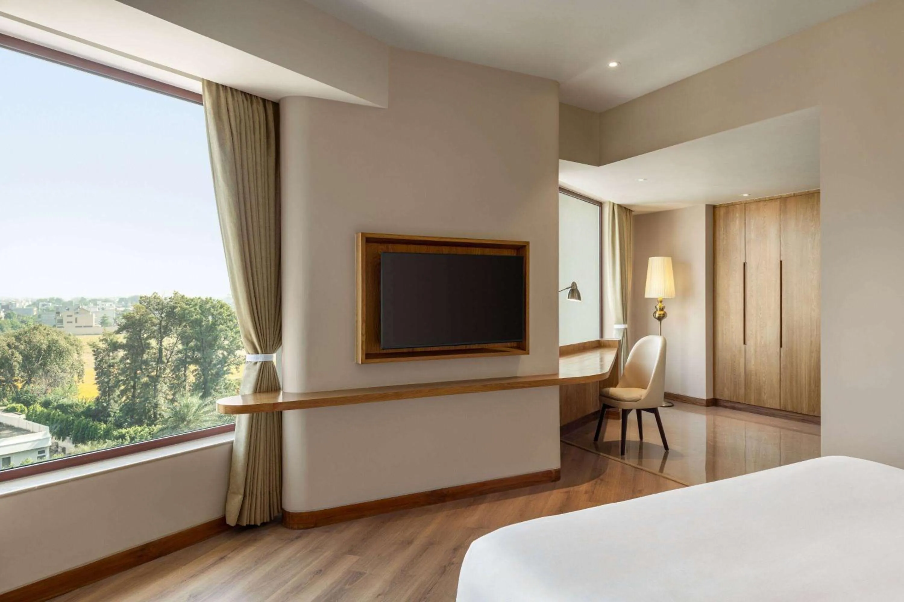 Photo of the whole room, Bed in Ramada Encore by Wyndham Amritsar Airport