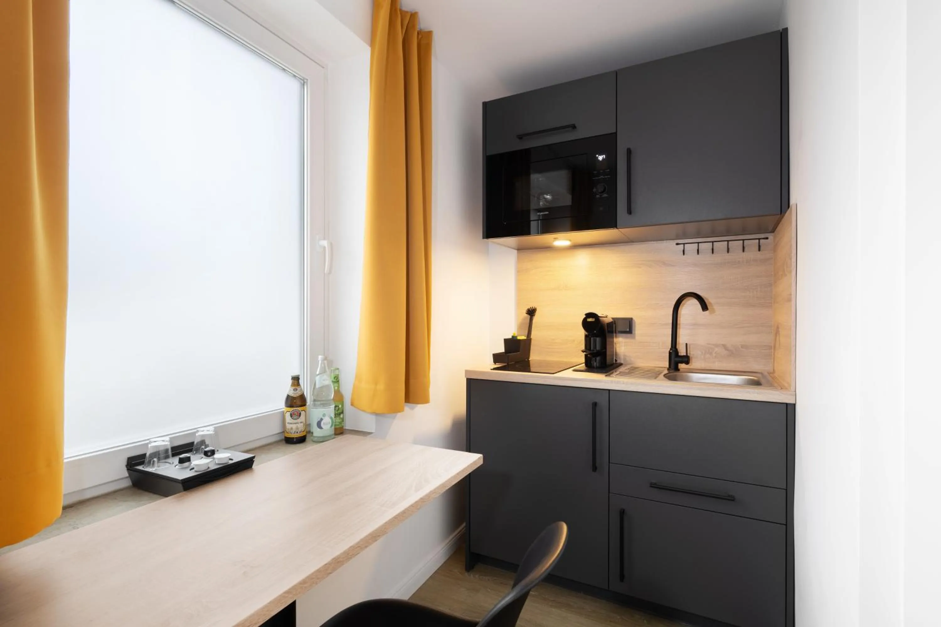 Kitchen or kitchenette in Homaris Apartments München Laim