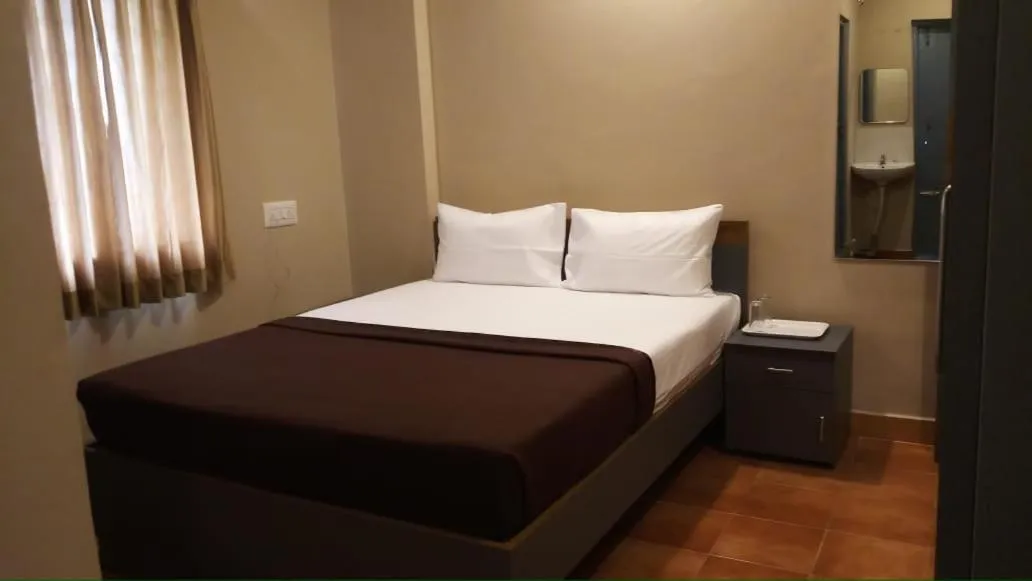 Bed in The Nisarga Residency