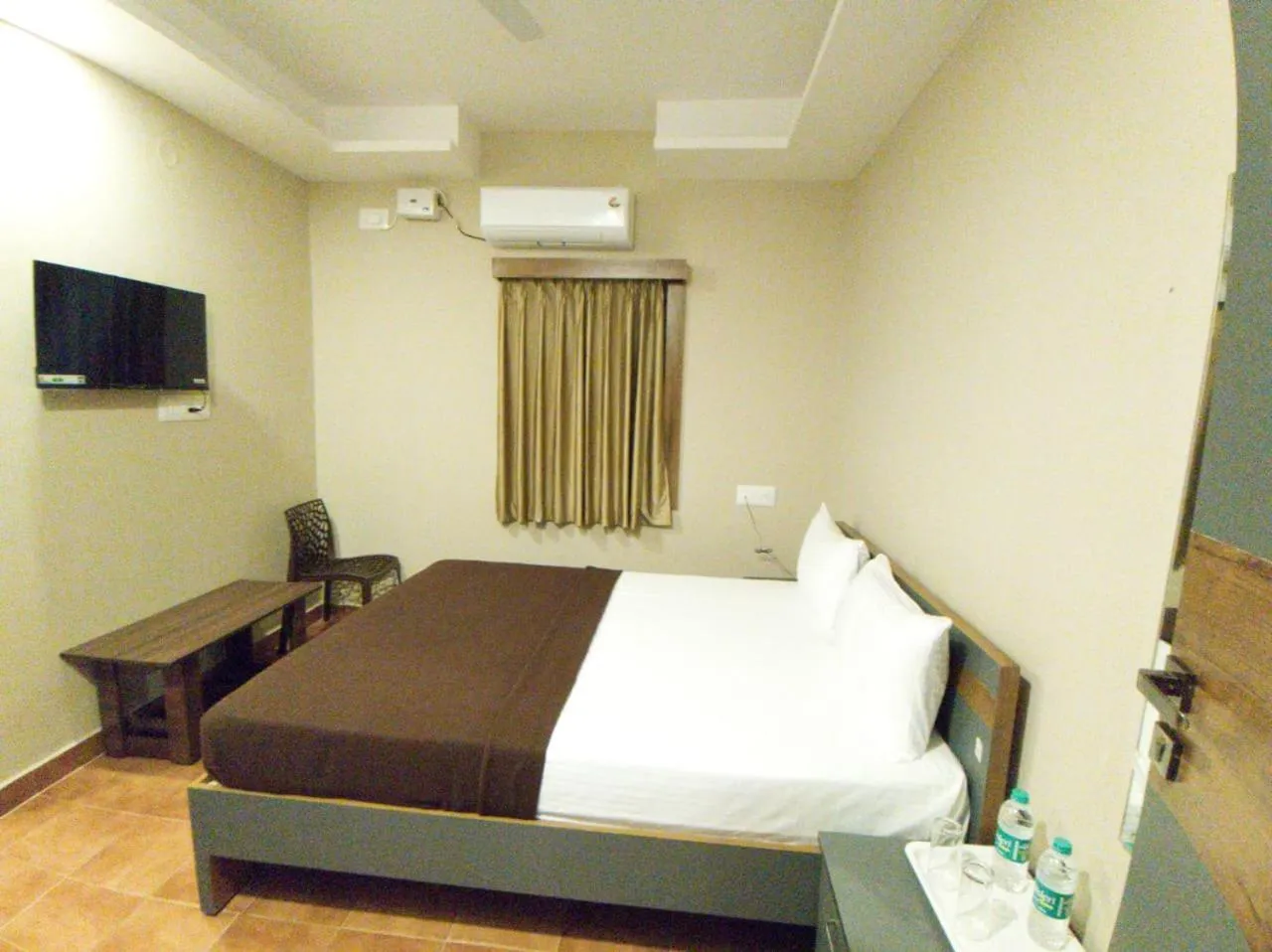 Communal lounge/ TV room, Bed in The Nisarga Residency