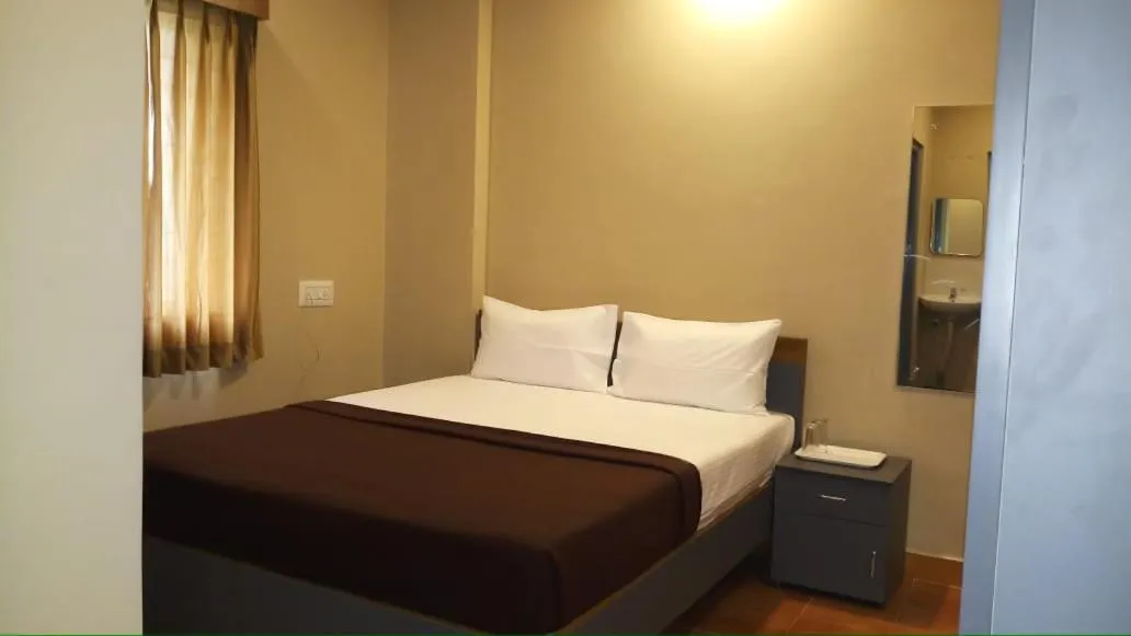 Bed in The Nisarga Residency