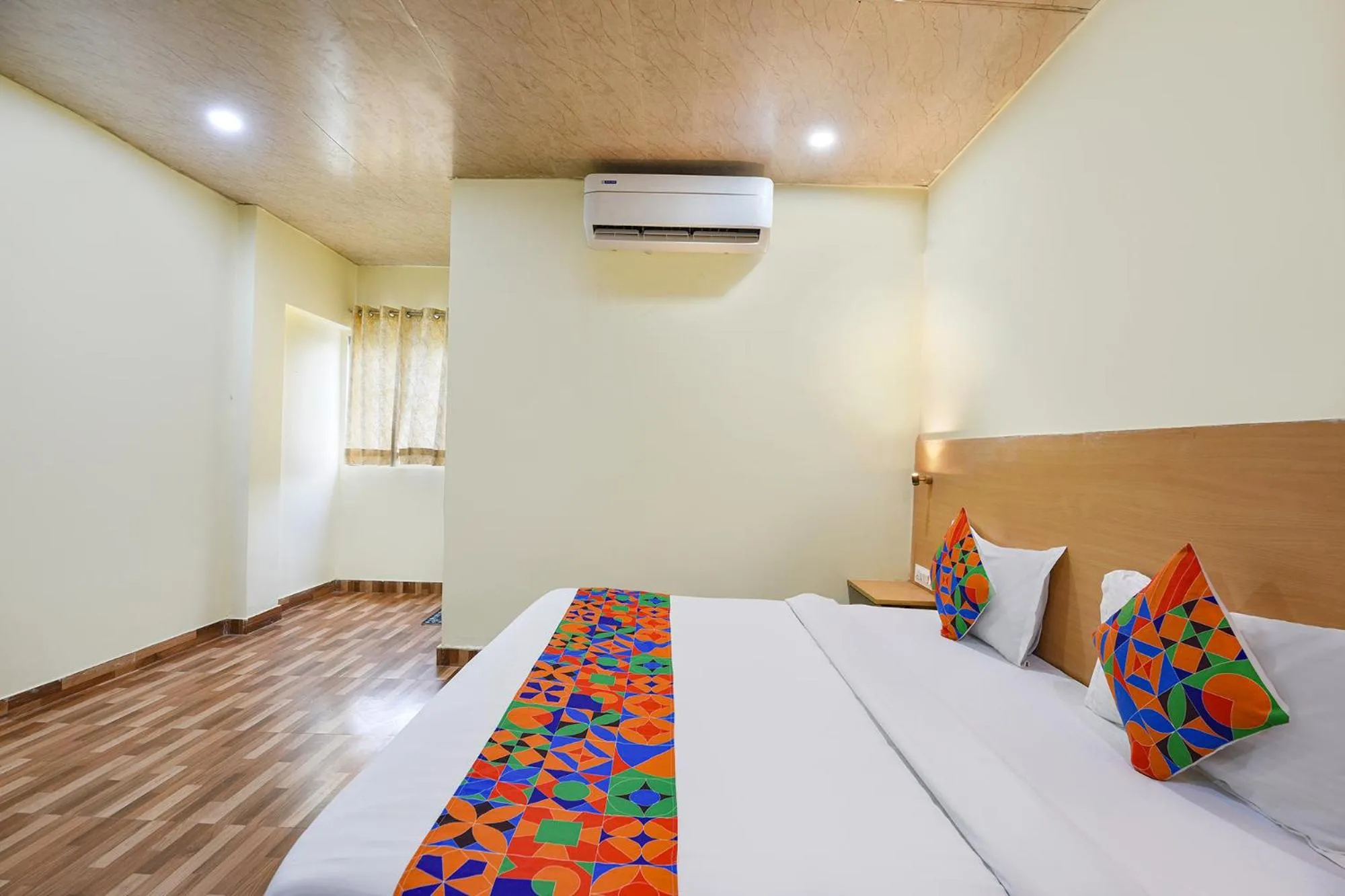 Bed in FabHotel Royal Reena Residency