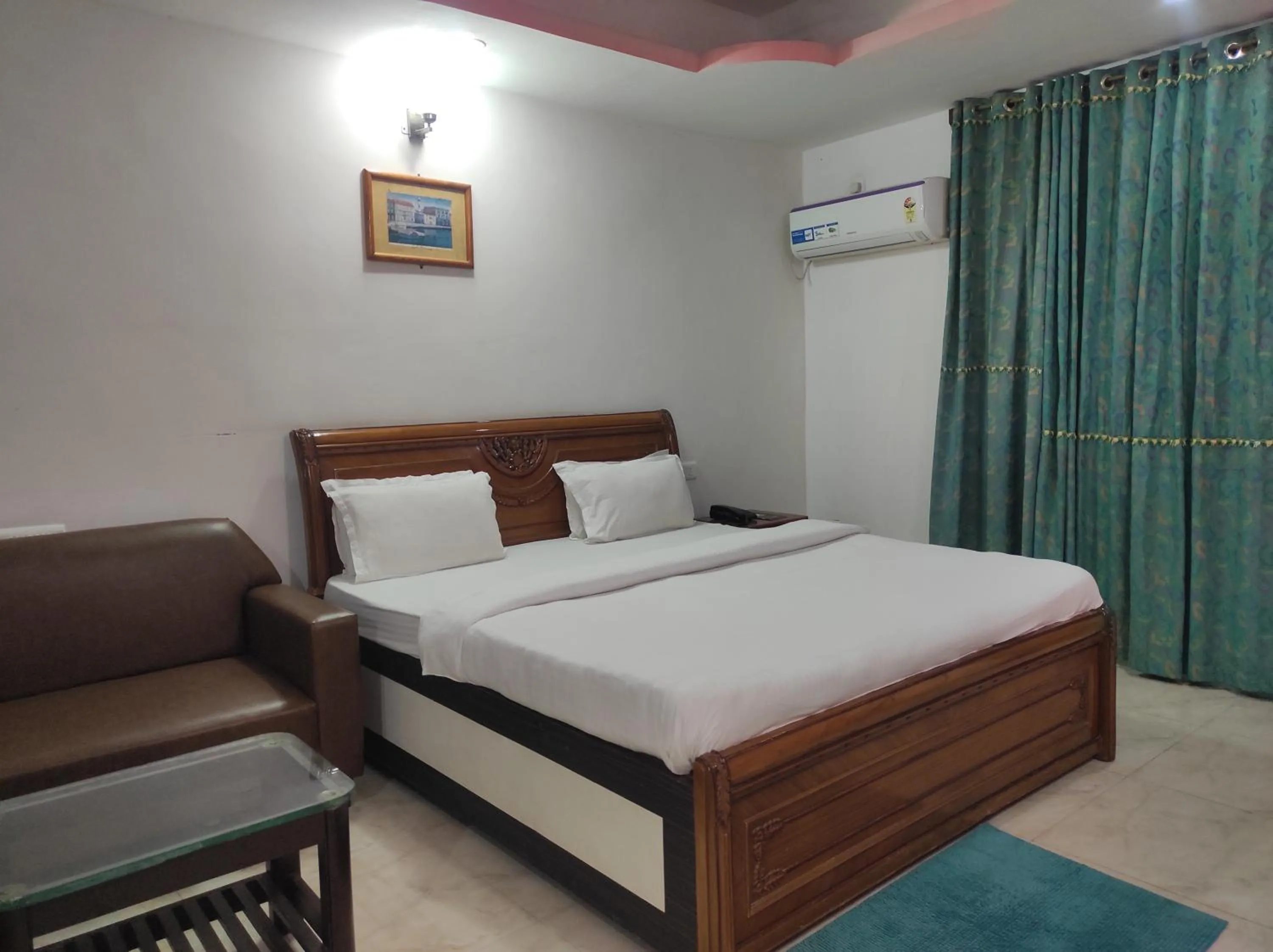 Bed in Hotel Sanjivani Heritage Top Best Budget Hotels in Dibrugarh, Assam