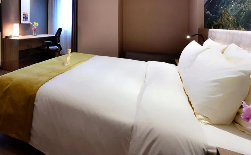 Bed in Atour Hotel Dalian Zhongshan Square