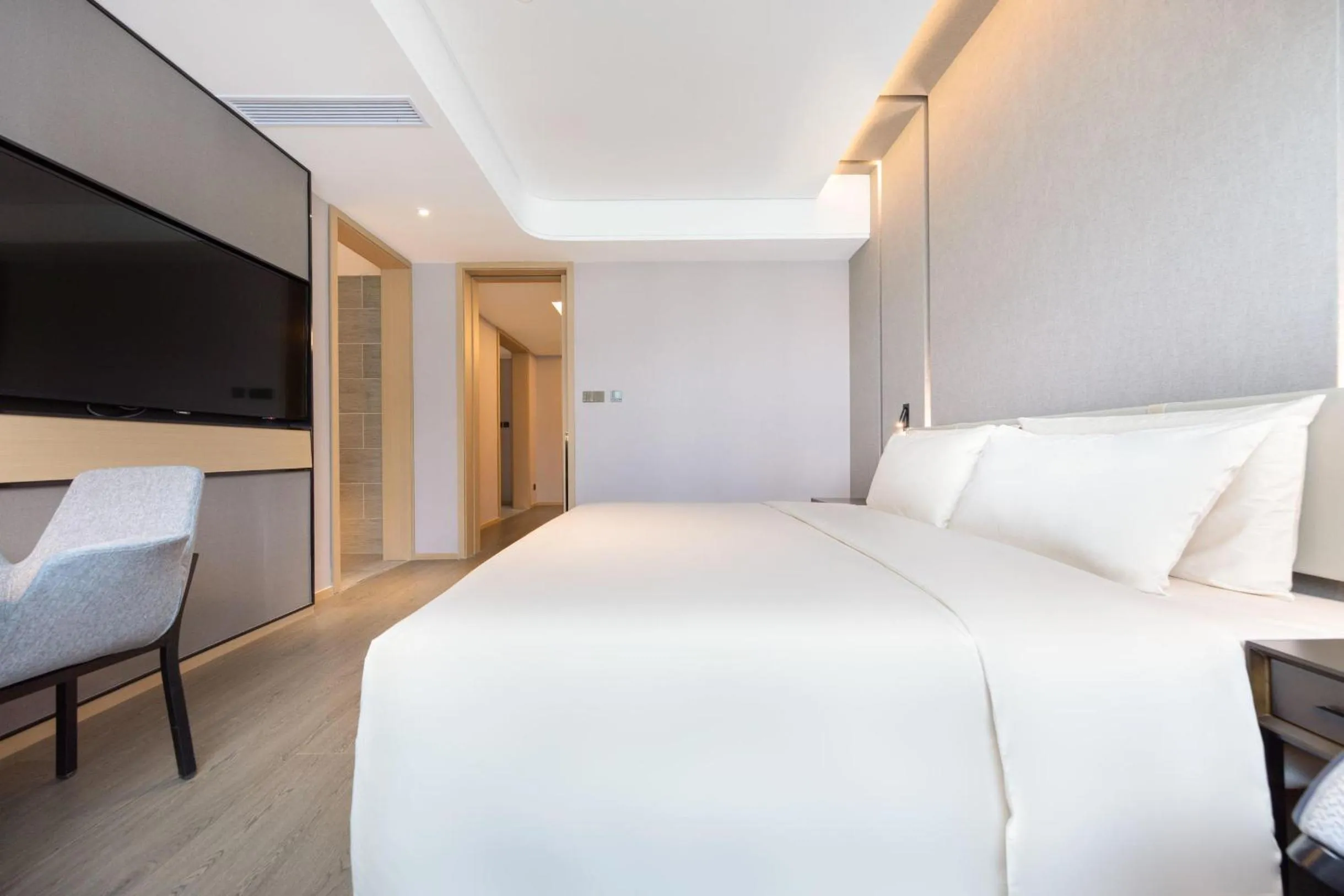 Bed in Atour Hotel Chongqing Guanyinqiao Flower Garden