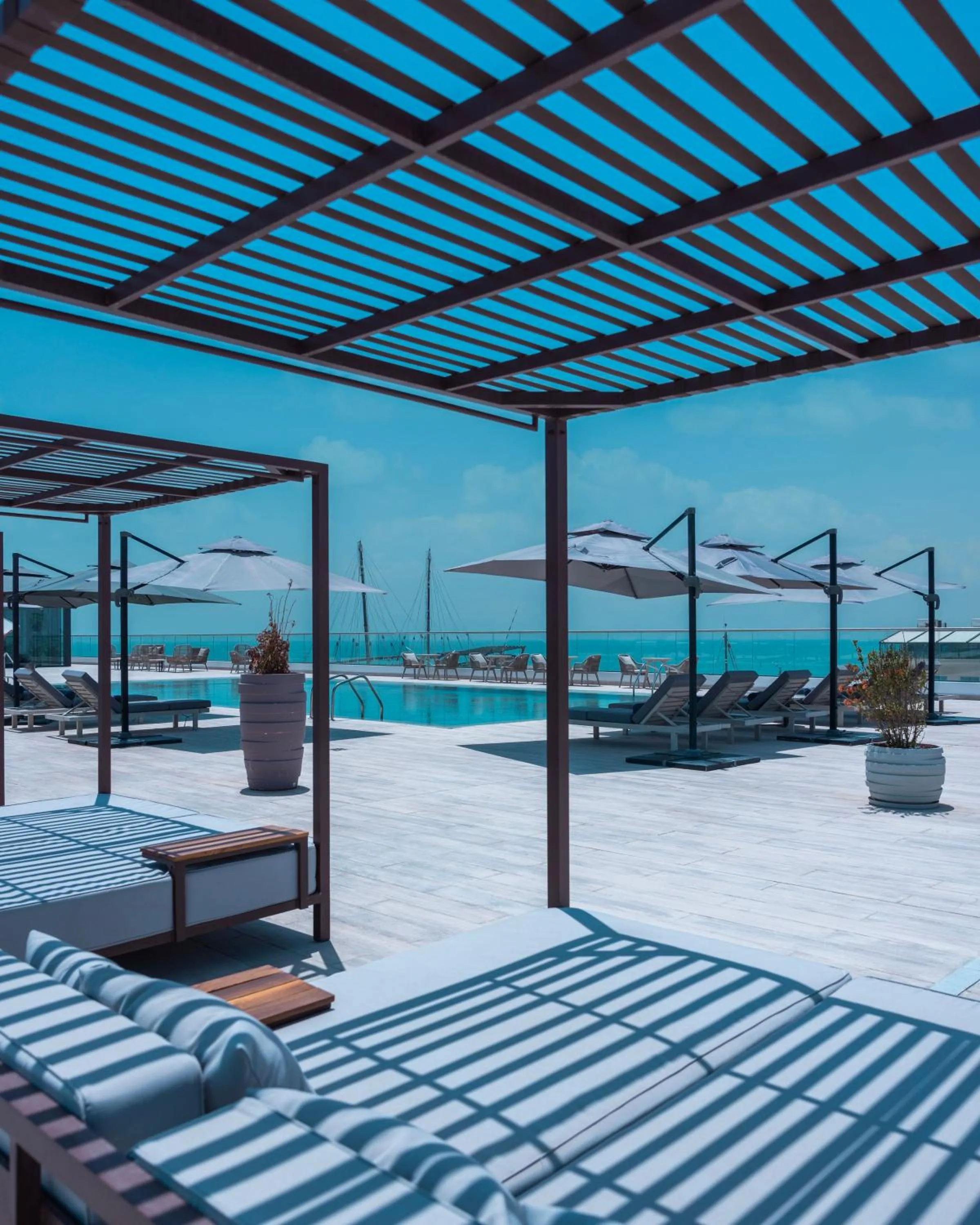 Pool view, Bed in Arabella Beach Hotel Kuwait, Vignette Collection by IHG