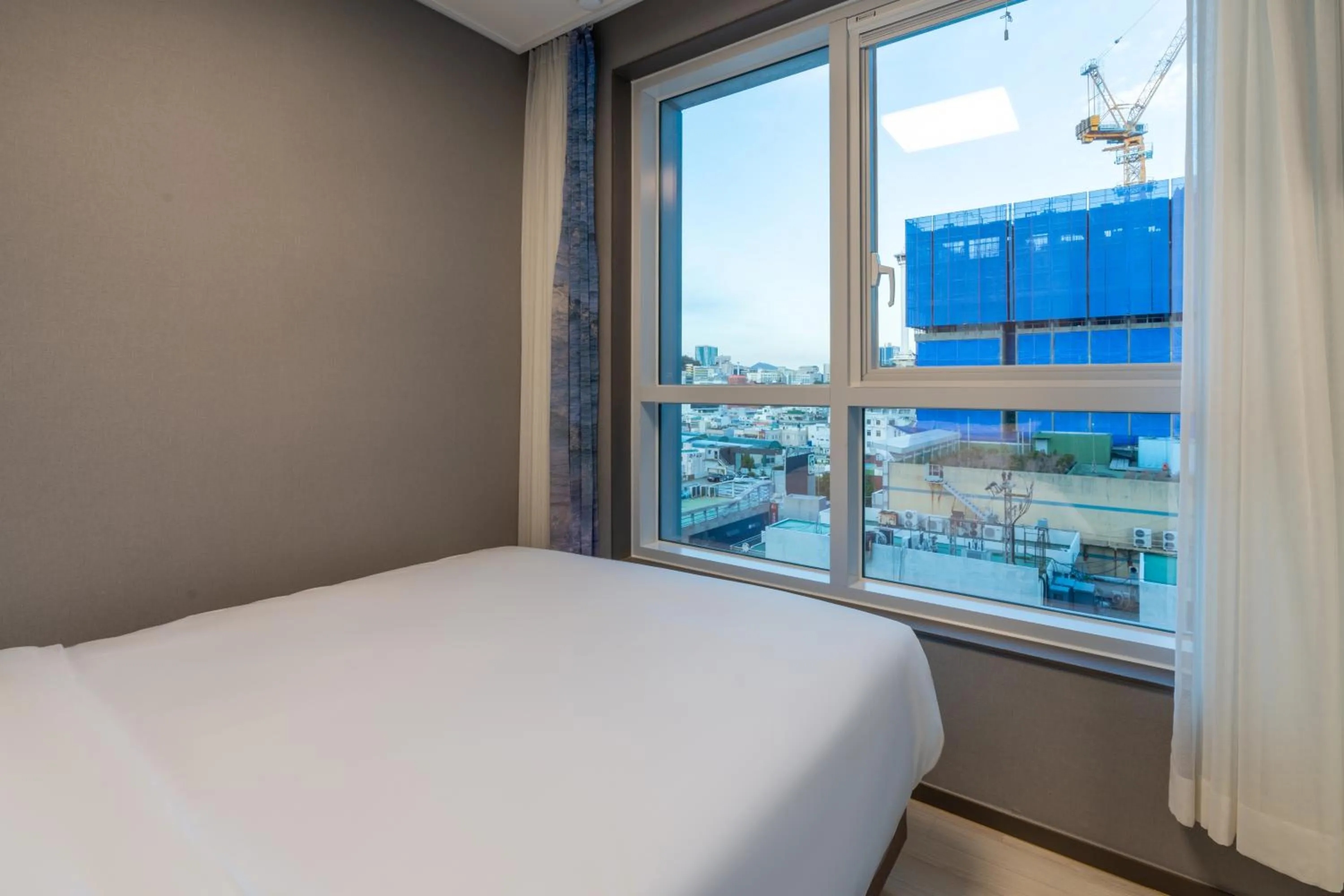 Bed in Radiant Nampo Hotel