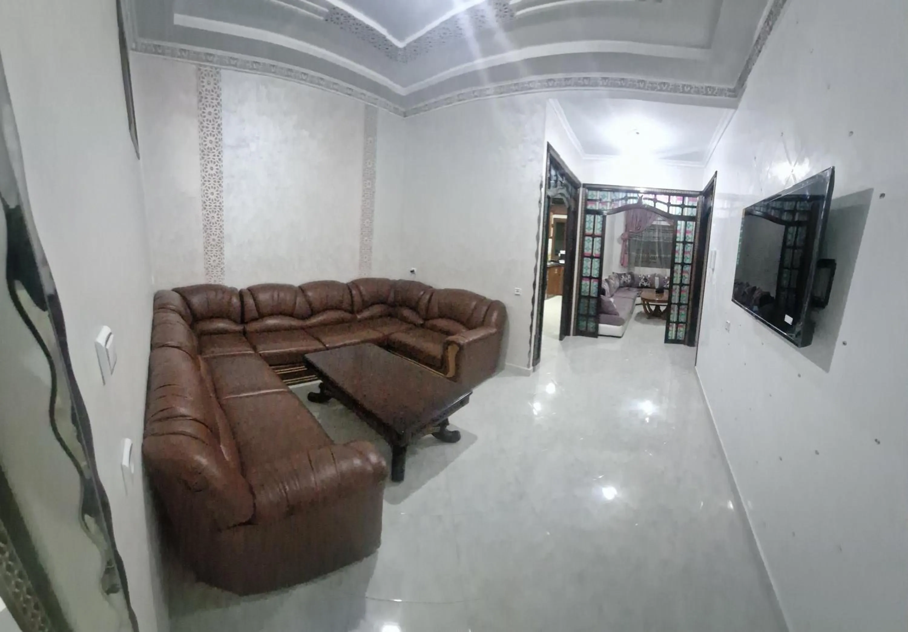 Communal lounge/ TV room in Résidence MIMOUNA FAMILY