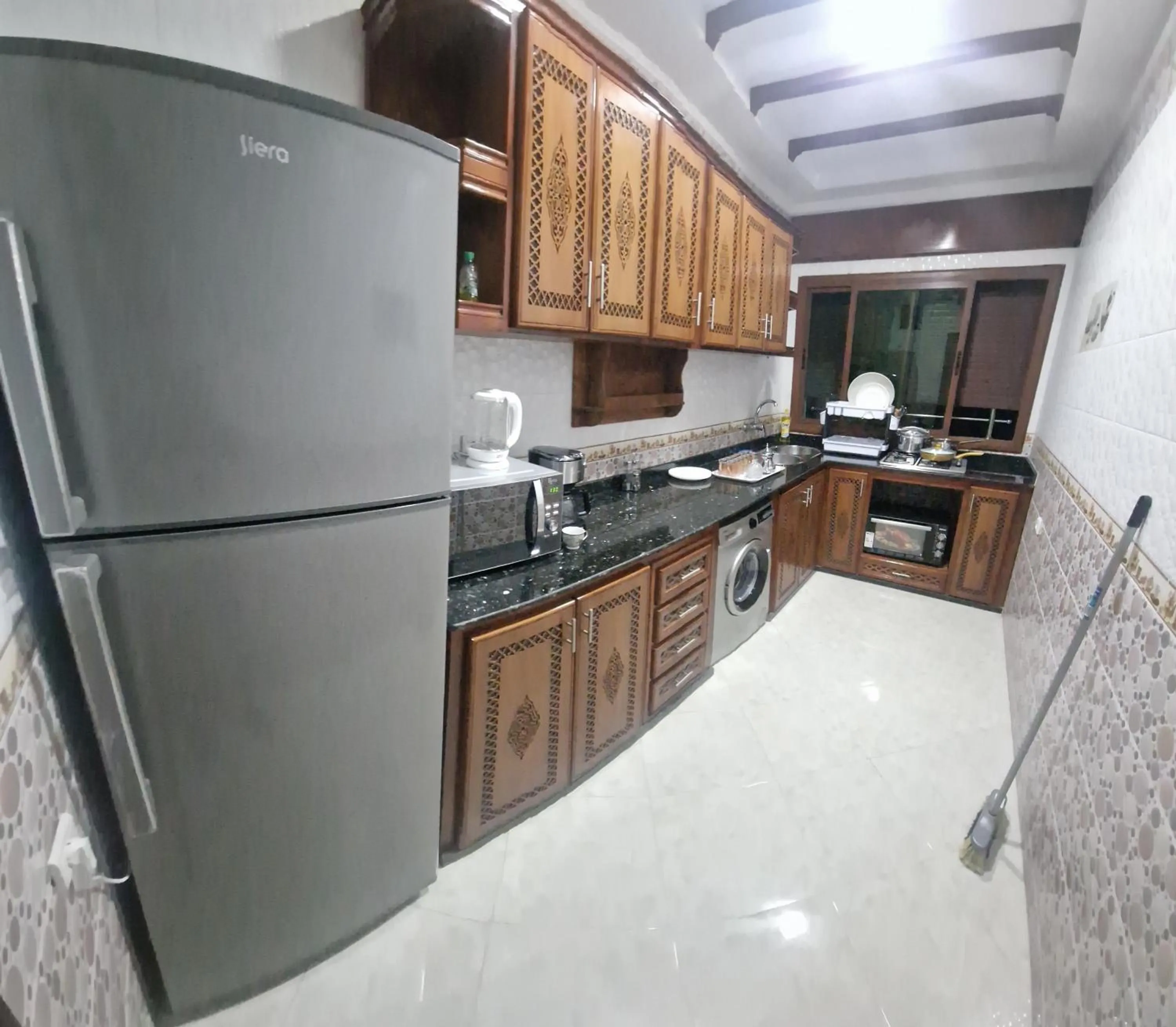 Kitchen or kitchenette in Résidence MIMOUNA FAMILY