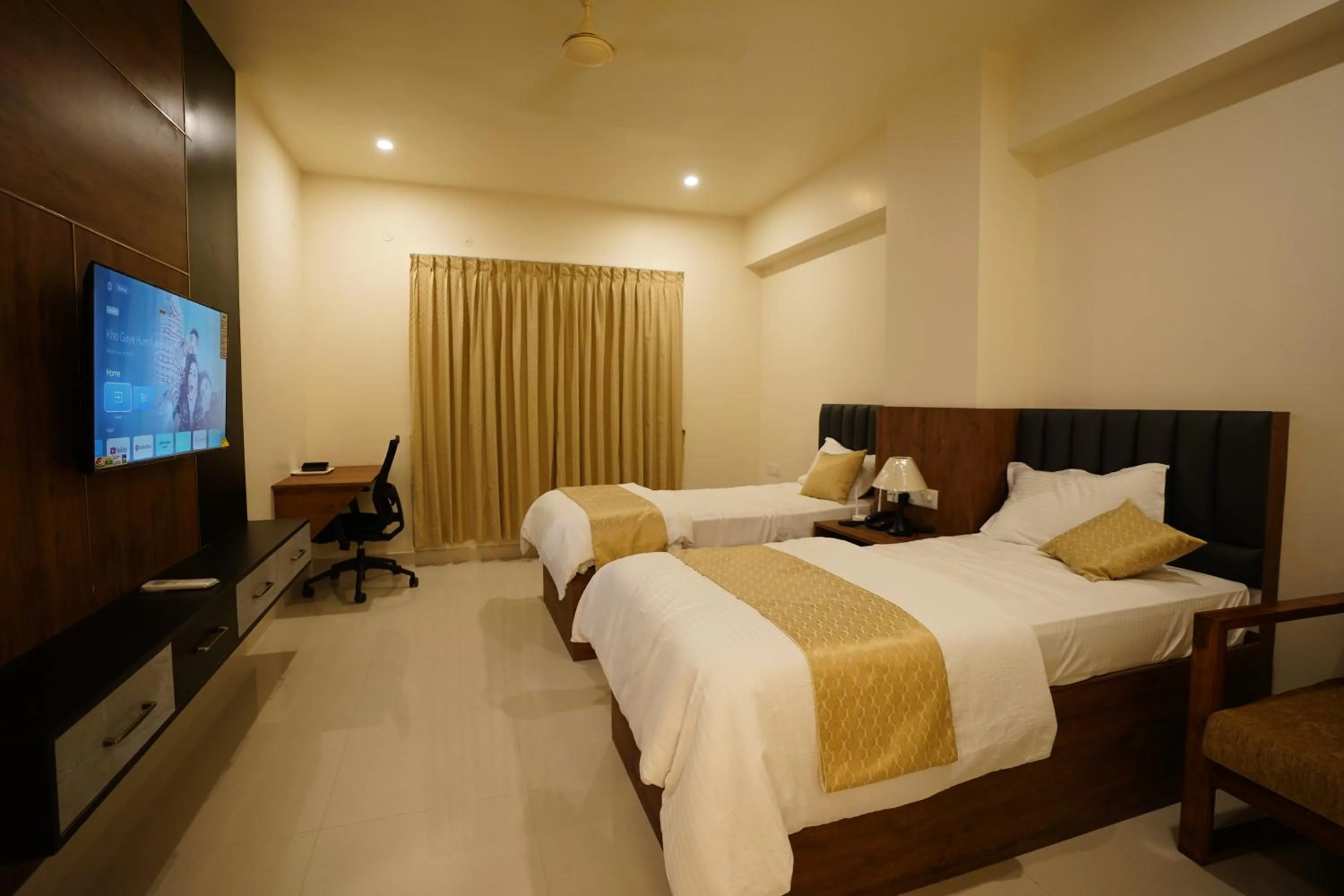 Bed in DrizzleDrop Inn Chennai