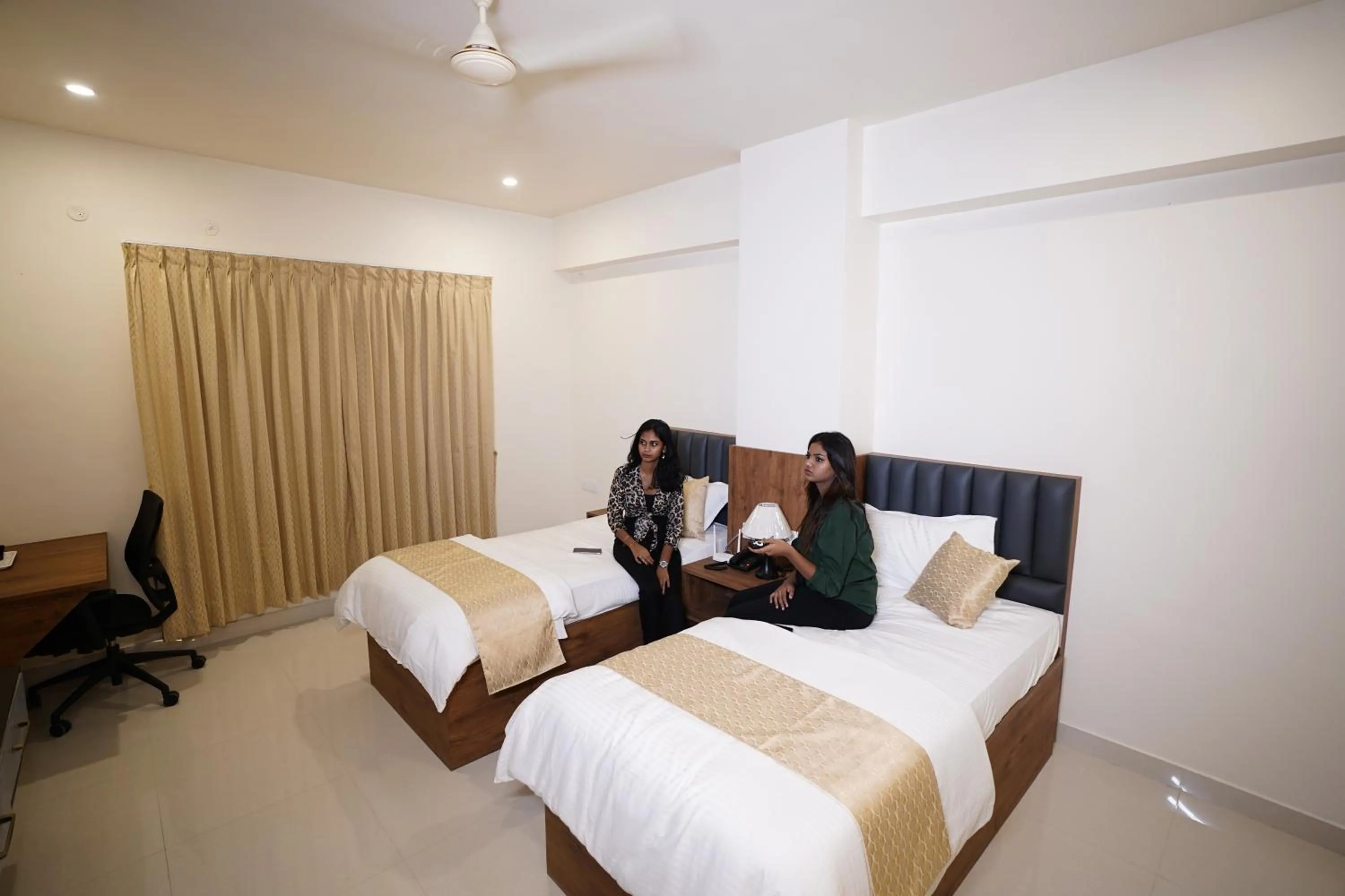 Bed in DrizzleDrop Inn Chennai