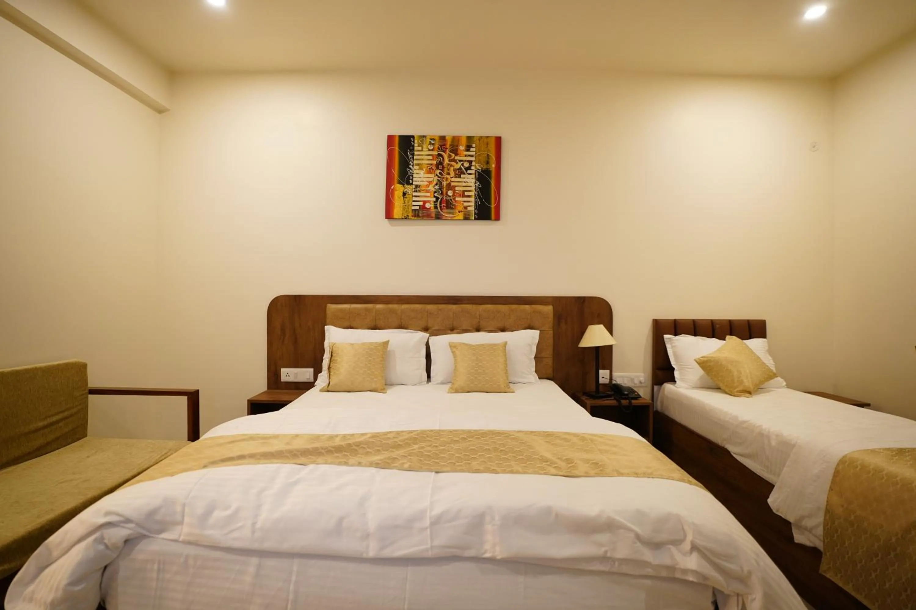 Bed in DrizzleDrop Inn Chennai