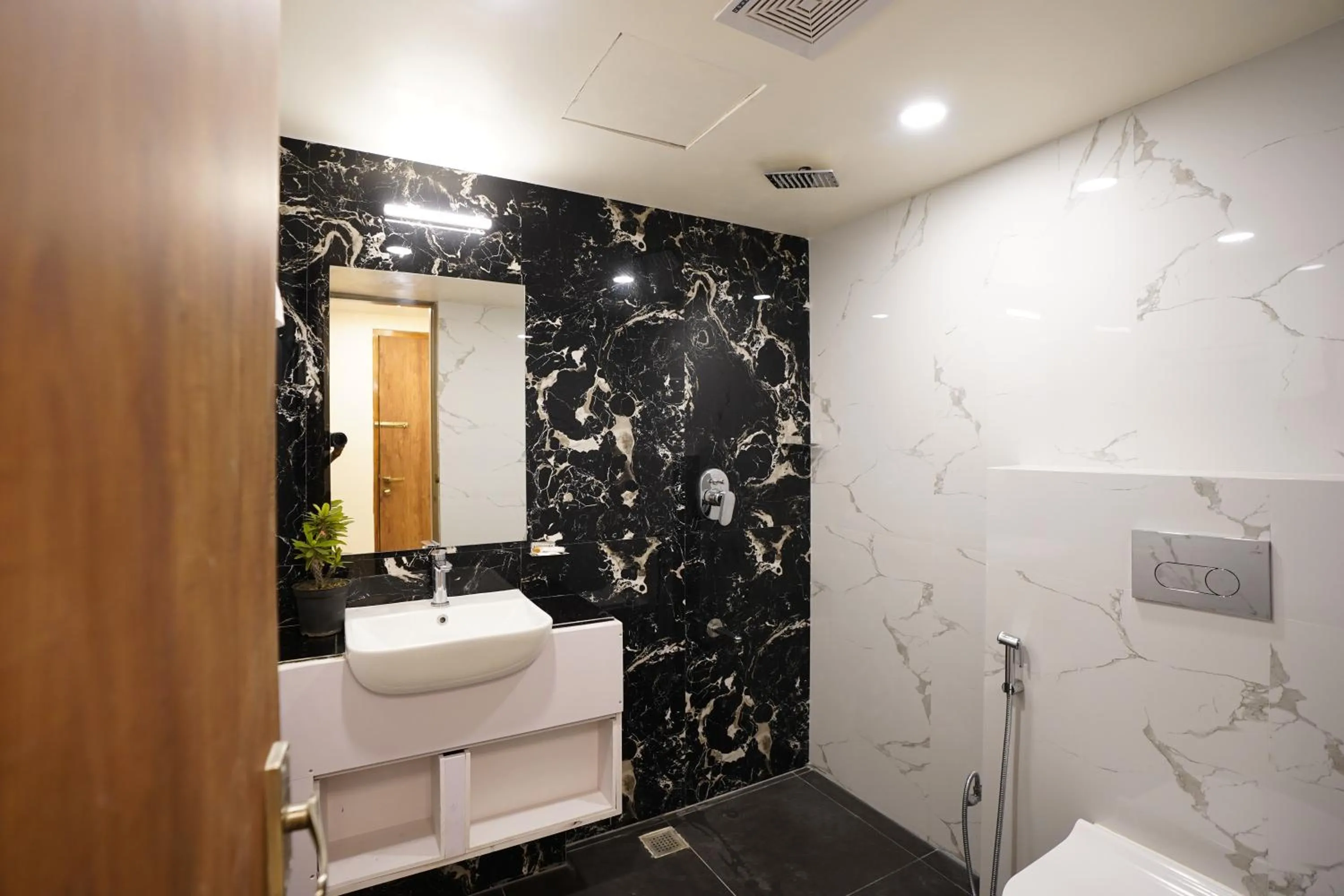 Shower in DrizzleDrop Inn Chennai