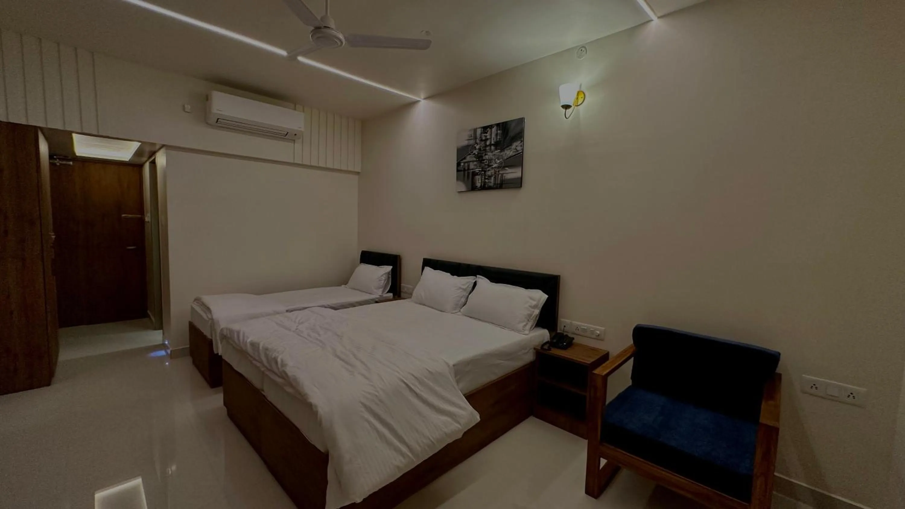 Bed in DrizzleDrop Inn Chennai