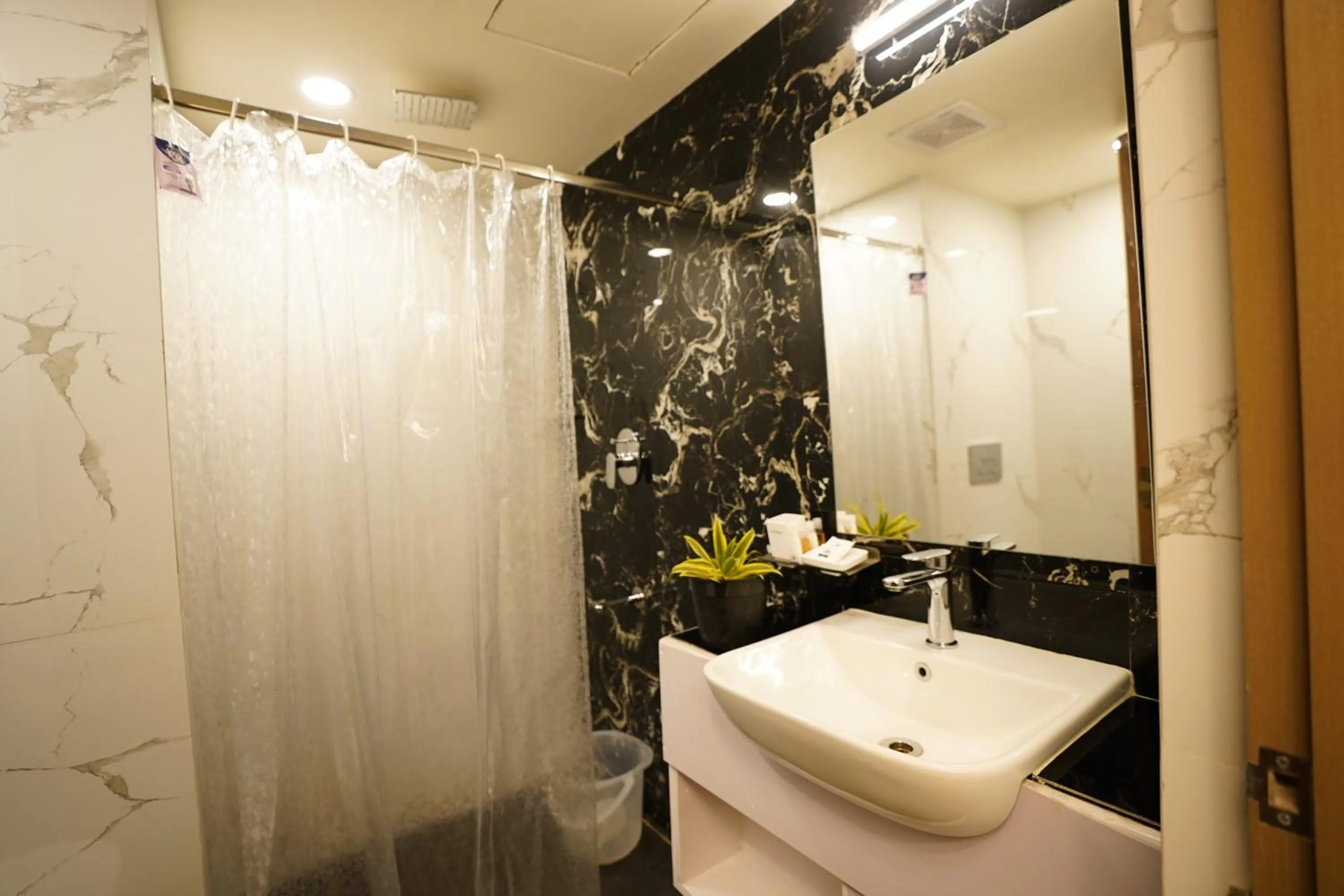 Shower in DrizzleDrop Inn Chennai