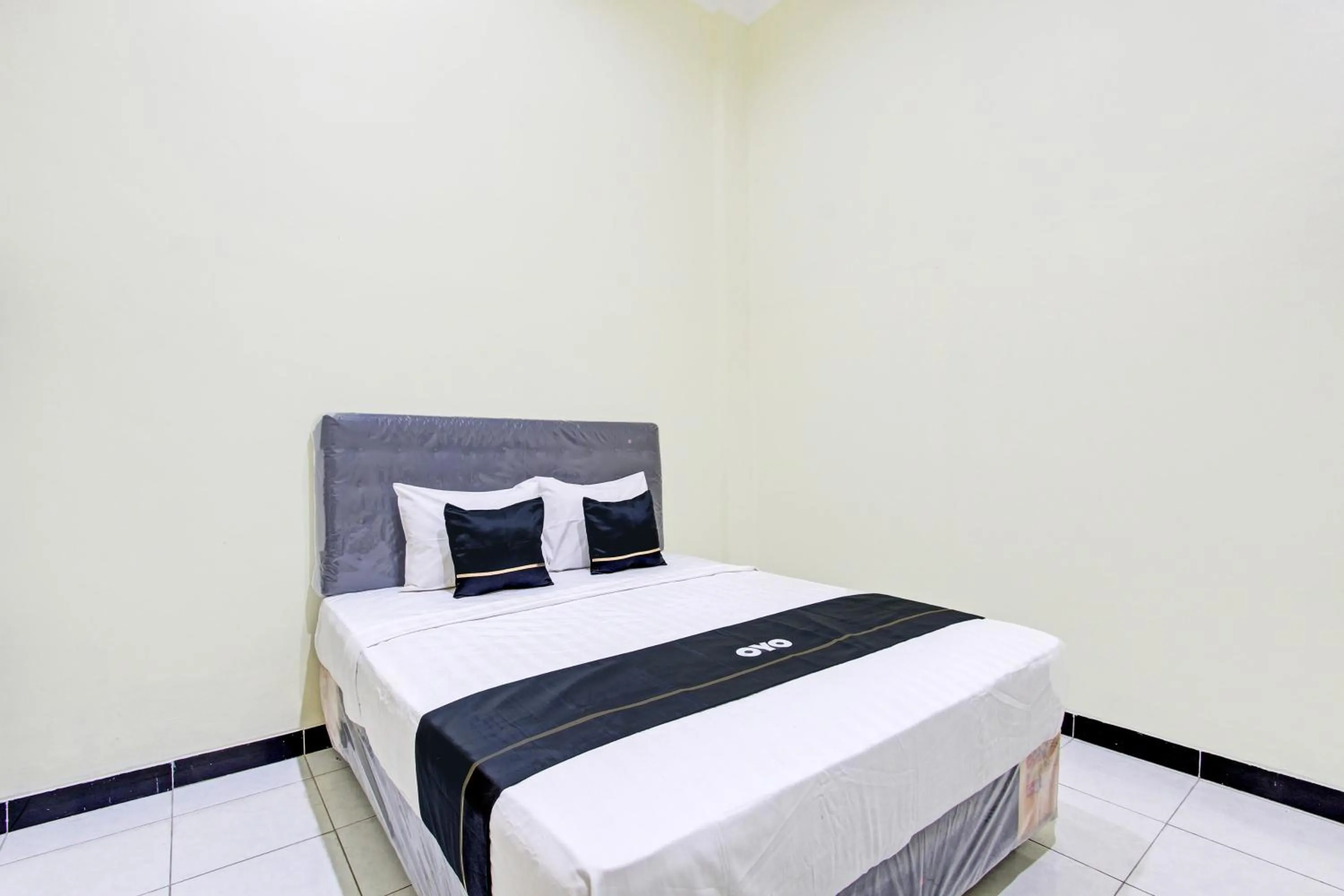 Bedroom in Super OYO Capital O 93204 Hotel Mulia Dua Syariah