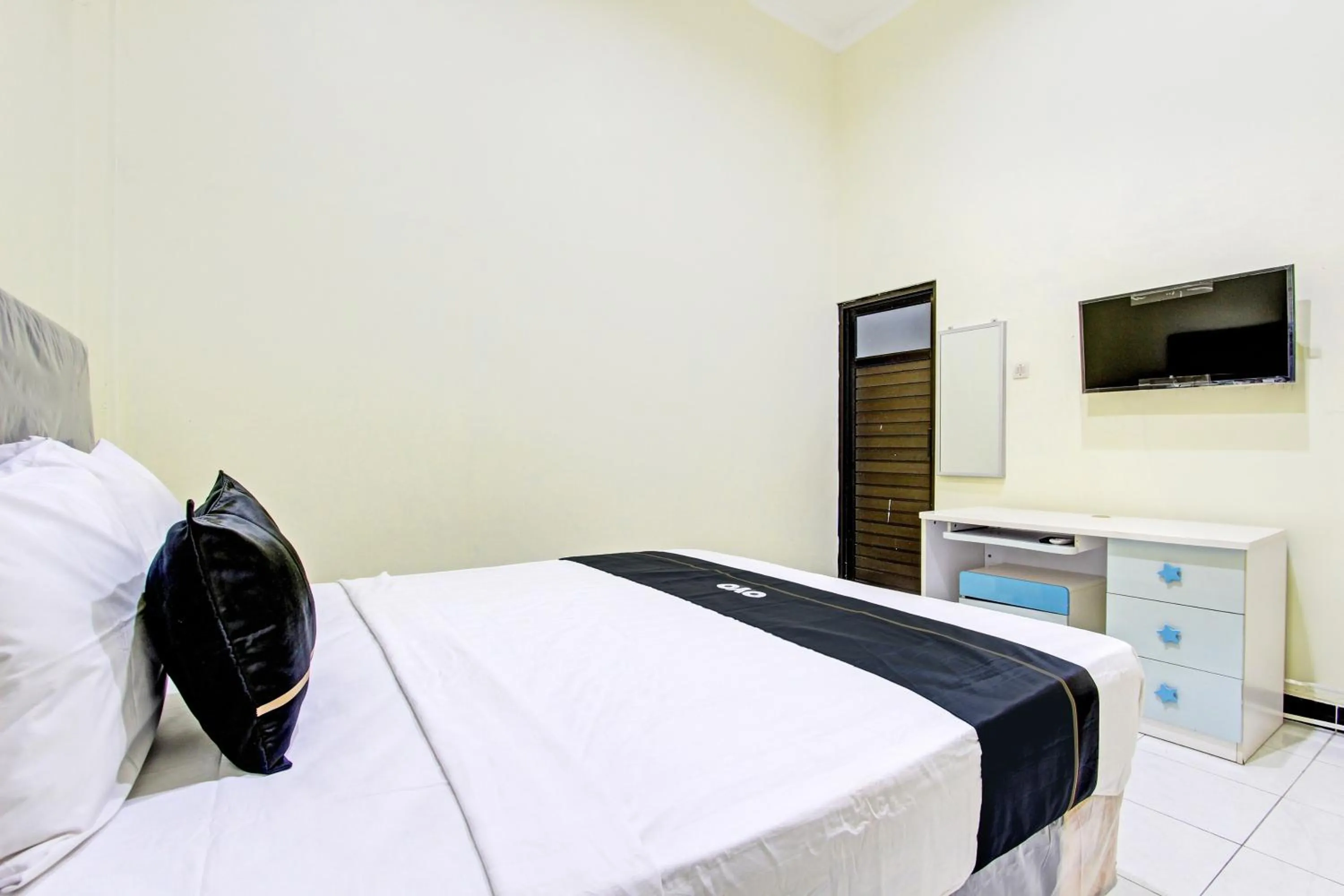 Bedroom in Super OYO Capital O 93204 Hotel Mulia Dua Syariah