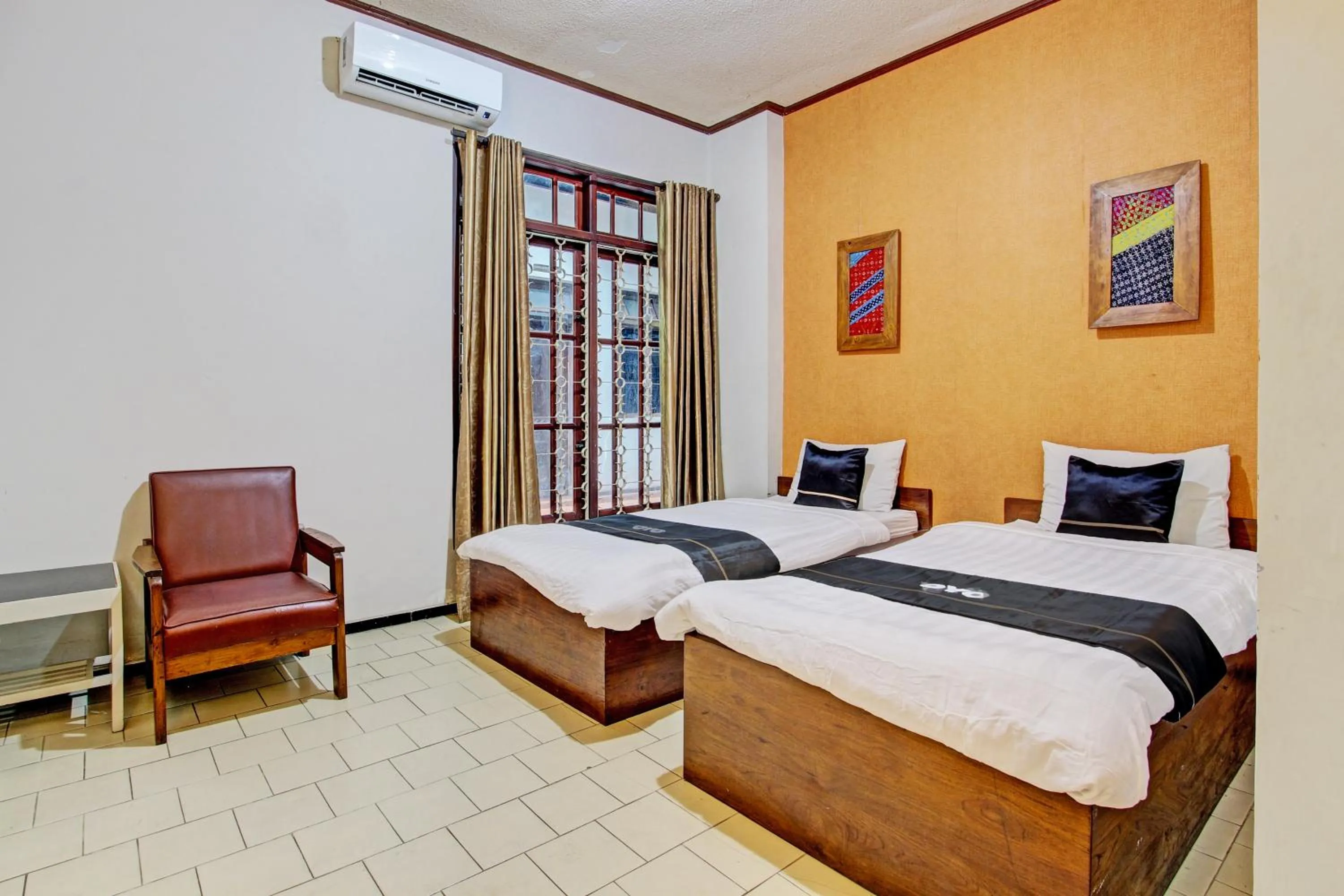 Bedroom in Super OYO Capital O 93240 Candra Dewi Hotel