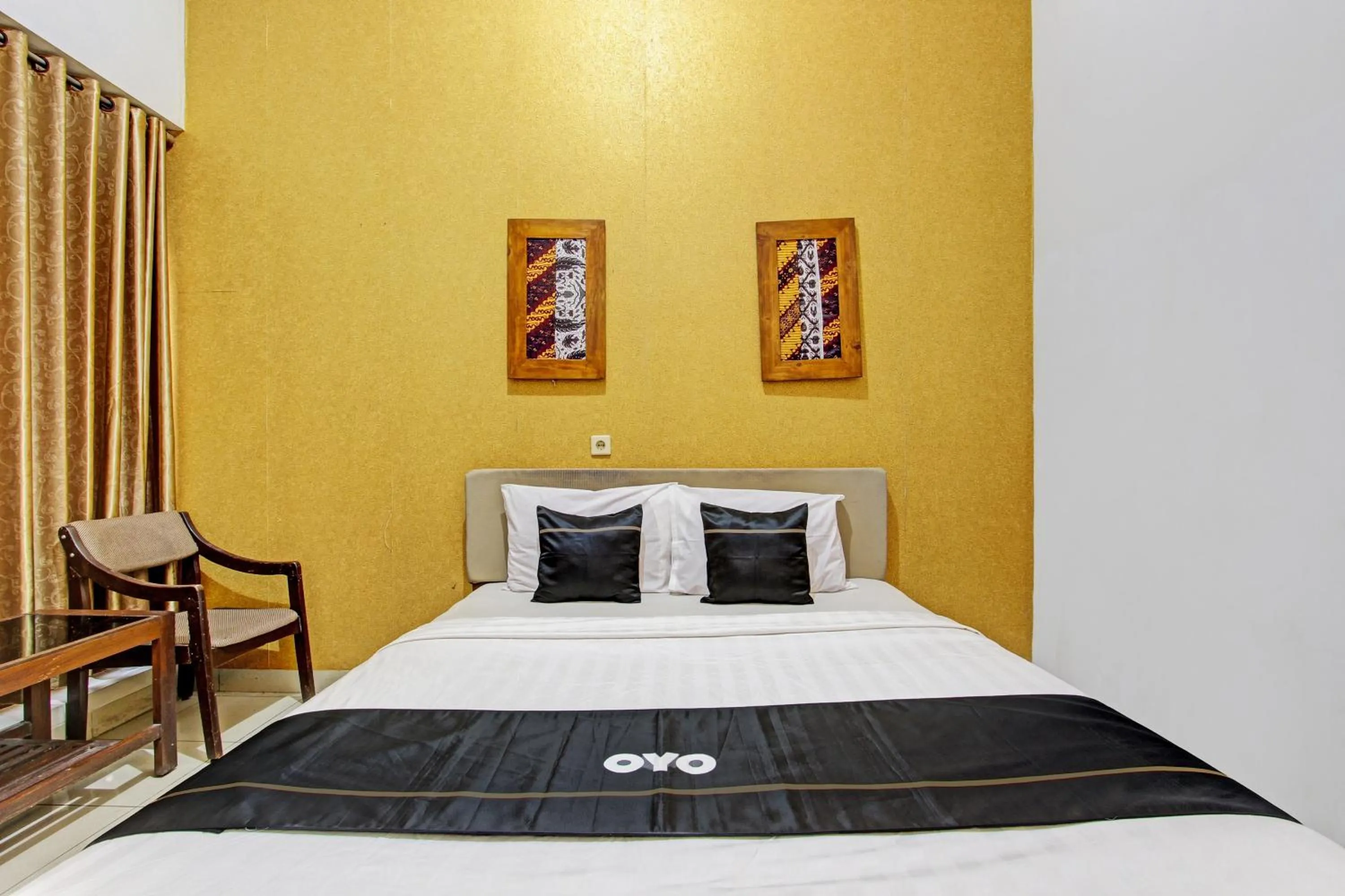 Bedroom in Super OYO Capital O 93240 Candra Dewi Hotel