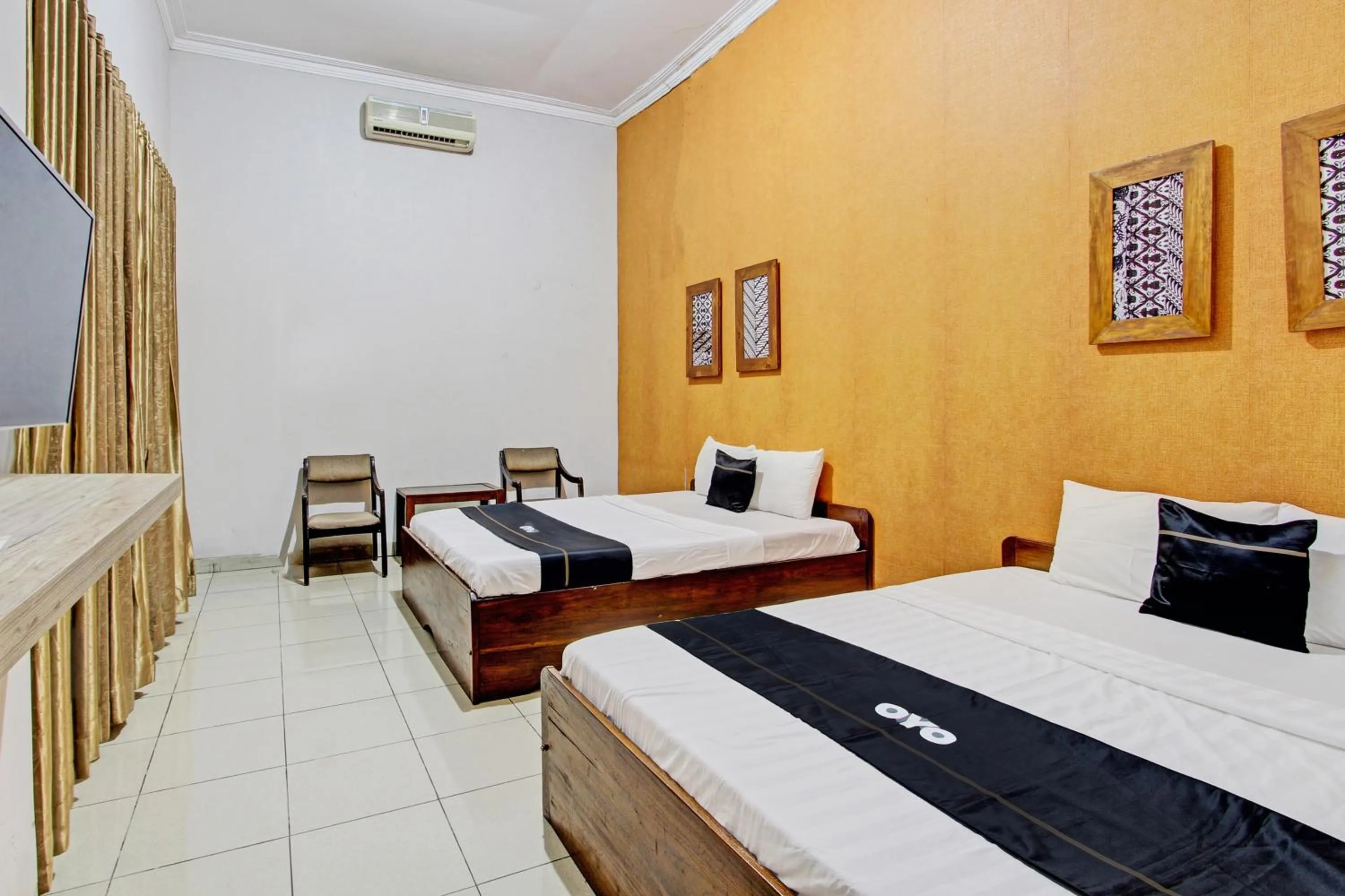 Bedroom in Super OYO Capital O 93240 Candra Dewi Hotel