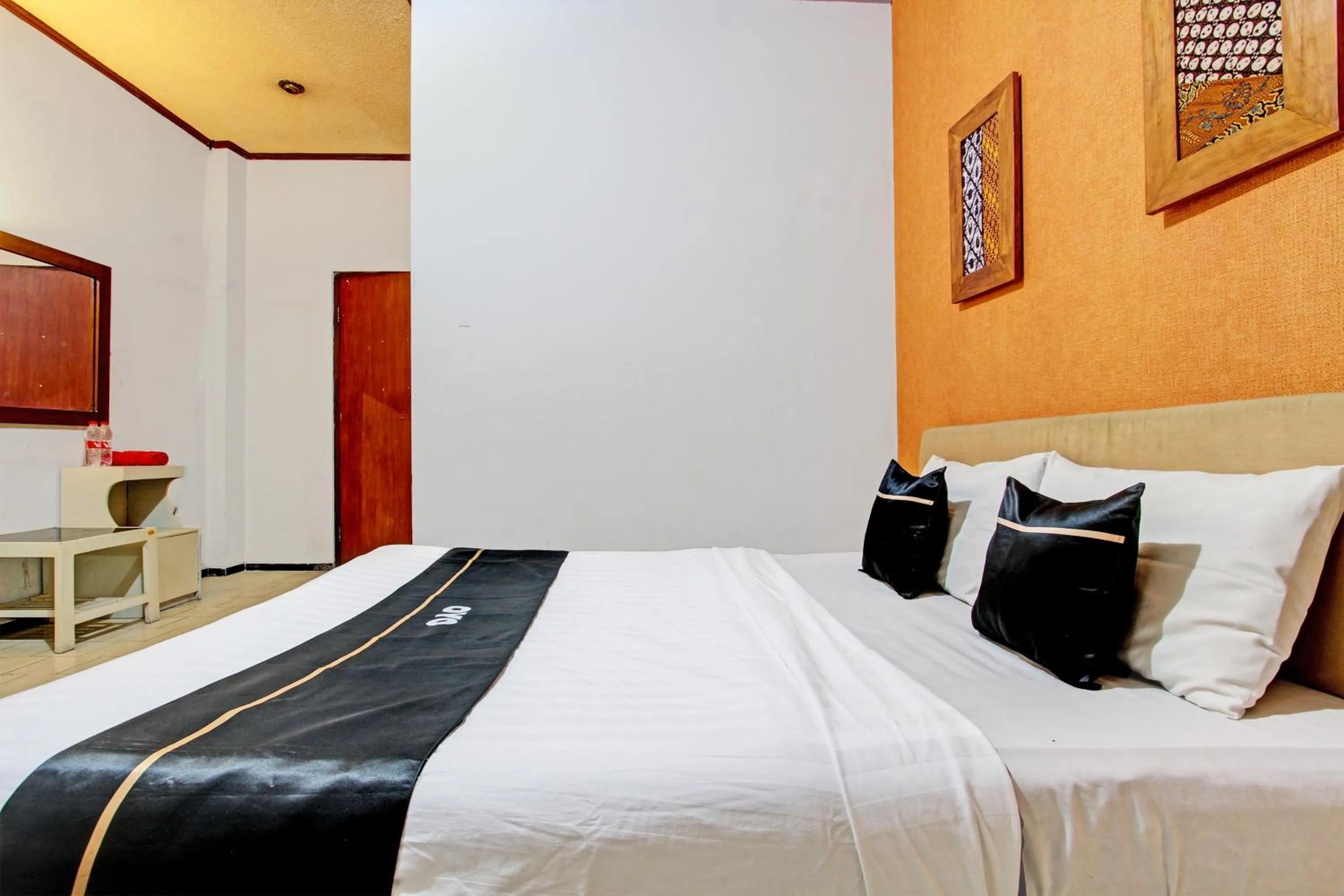 Bedroom in Super OYO Capital O 93240 Candra Dewi Hotel