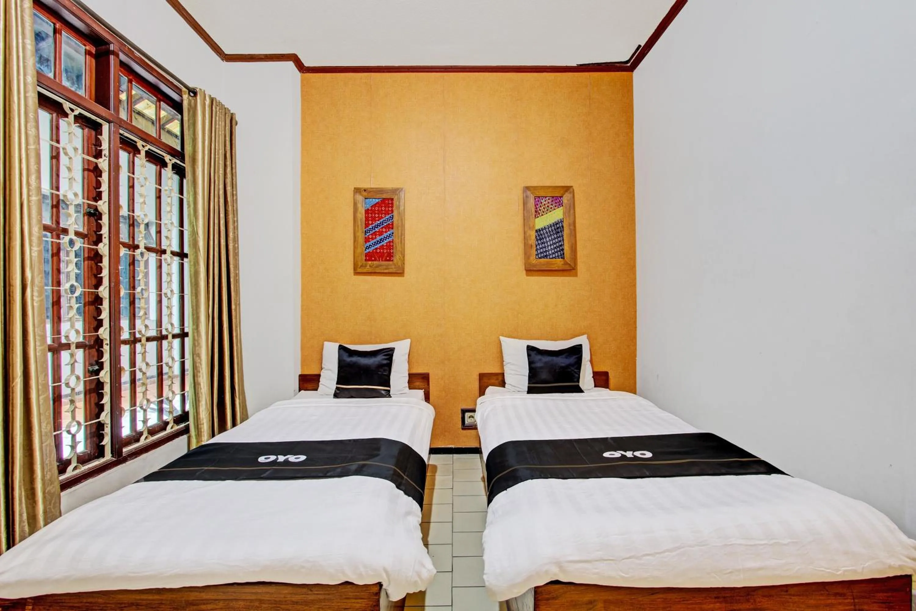 Bedroom in Super OYO Capital O 93240 Candra Dewi Hotel