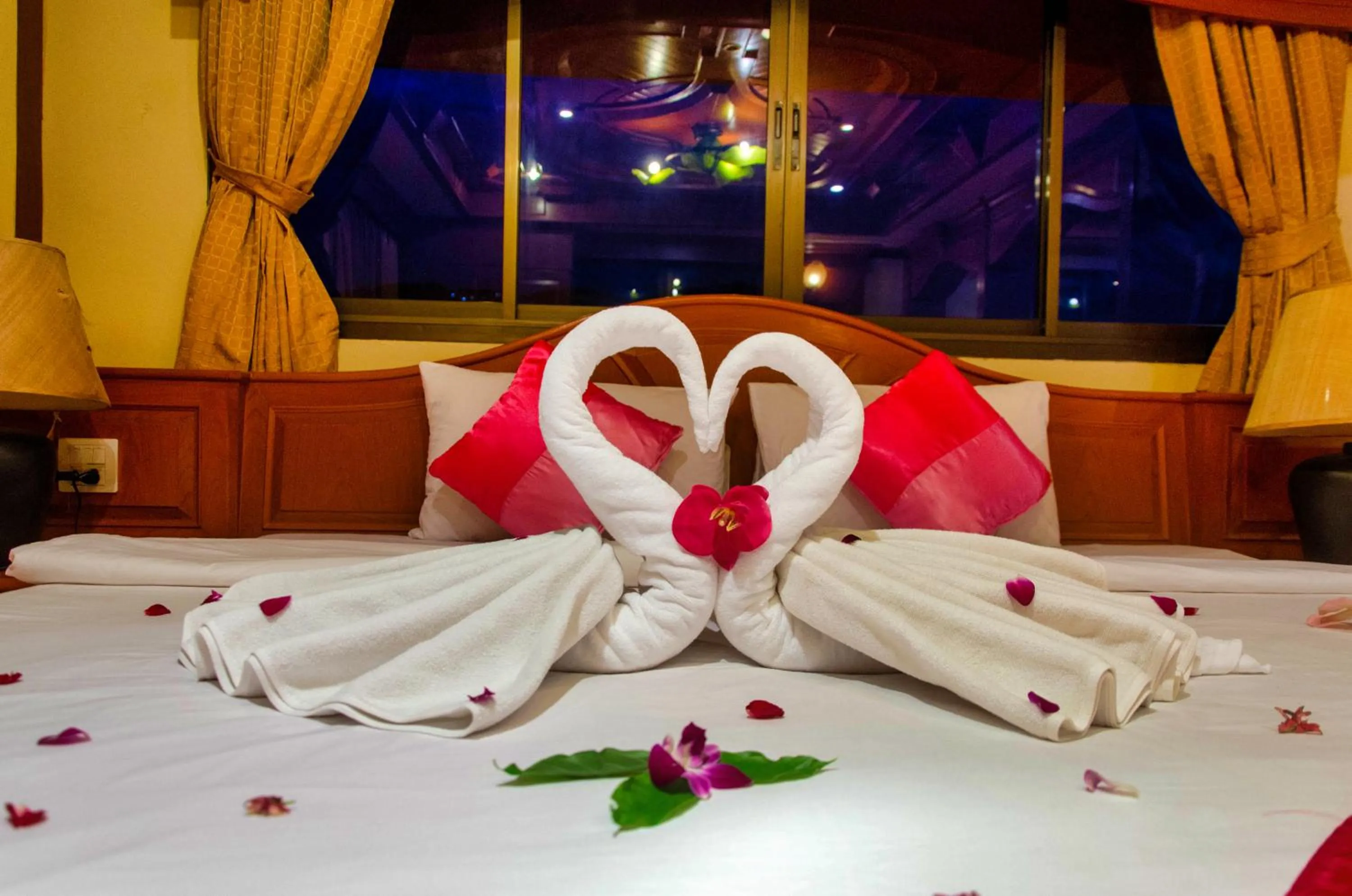 Bed in Diva Patong Hotel