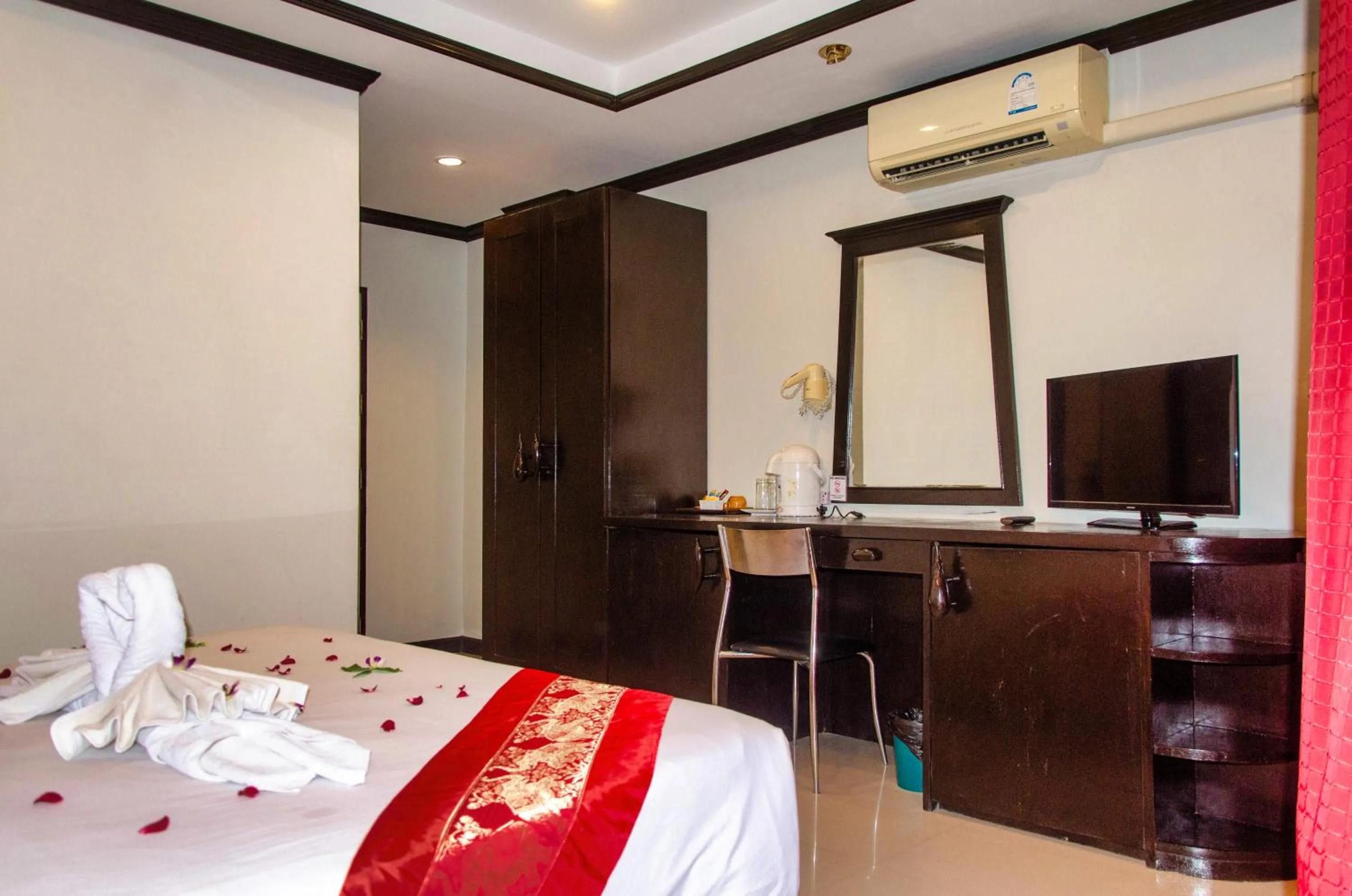 Bed in Diva Patong Hotel