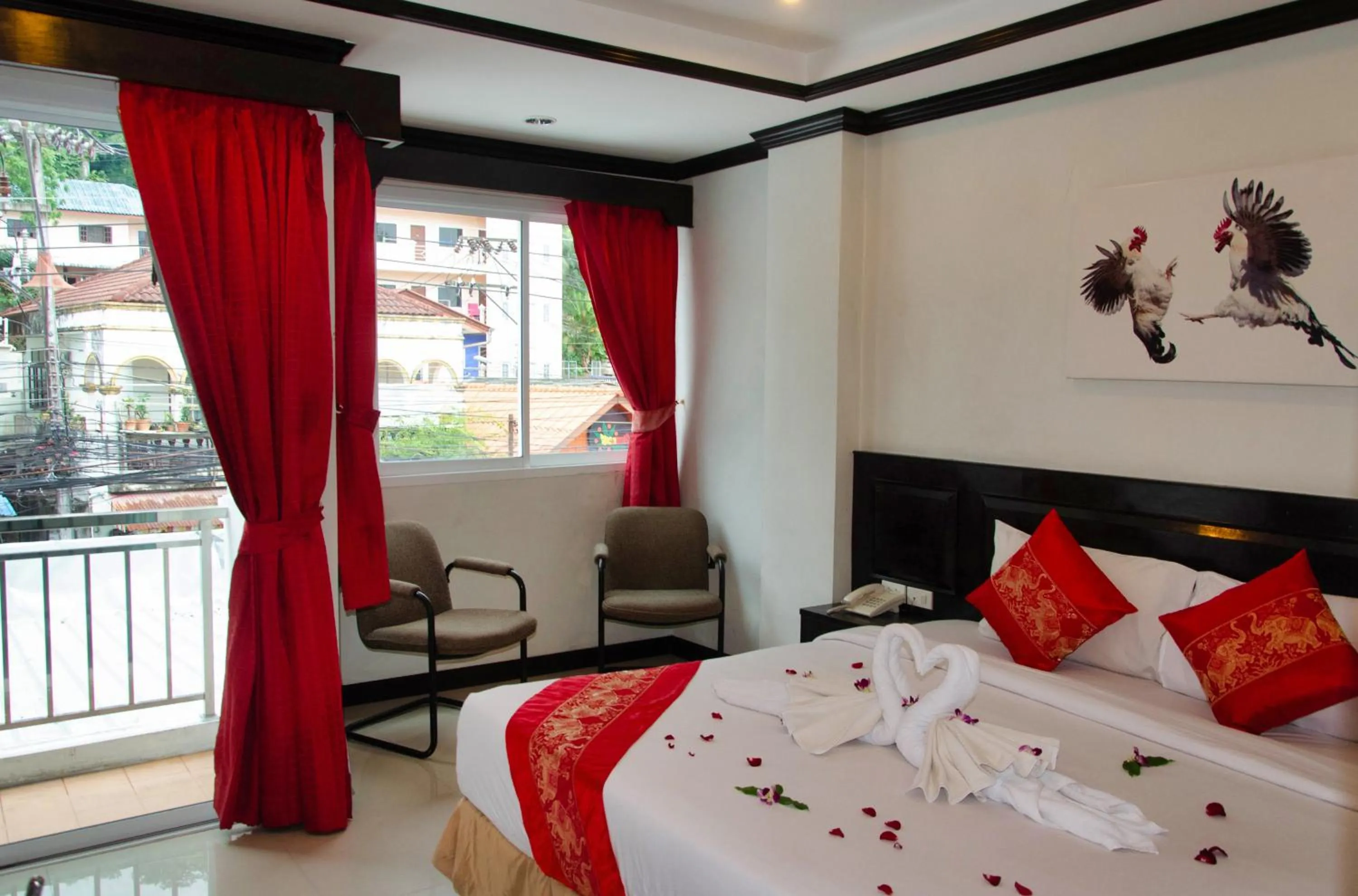 Bed in Diva Patong Hotel