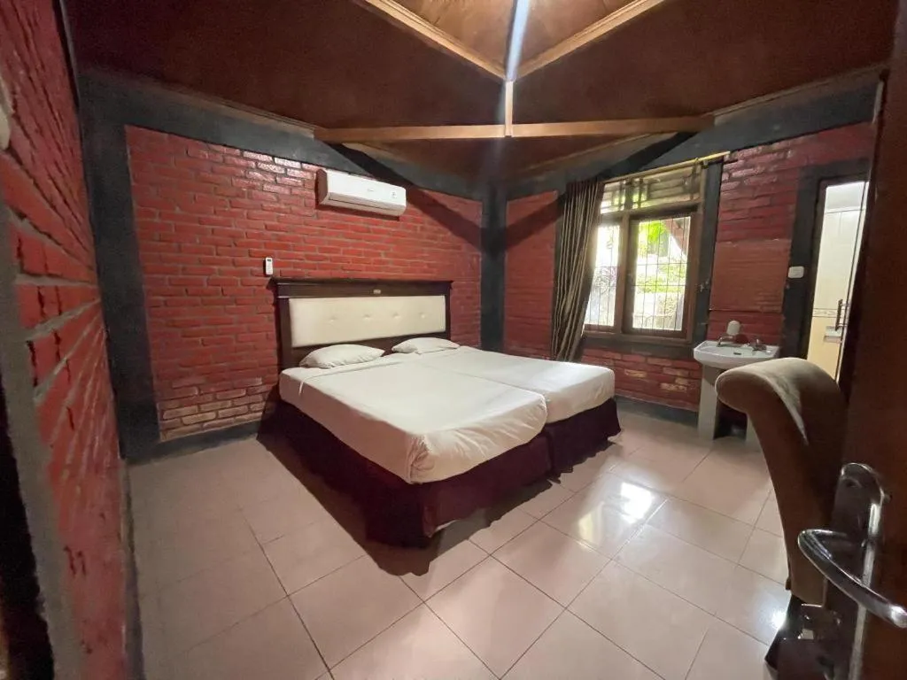 Bed in Rizen Premiere Hotel