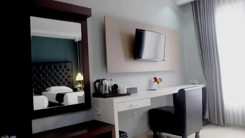 Bed in Rizen Premiere Hotel